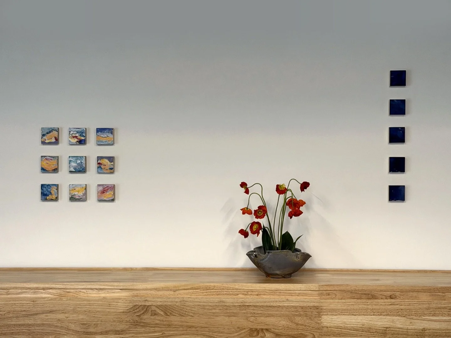 I love the dialogue between these works! Lingering Shifts (on left) is grid of nine skycape oil paintings mounted on poplar. Vessel #9 (middle) is a wood-fired ceramic by Allen Yu. Fragments xix is vertical arrangement of five subtle oil paintings mo