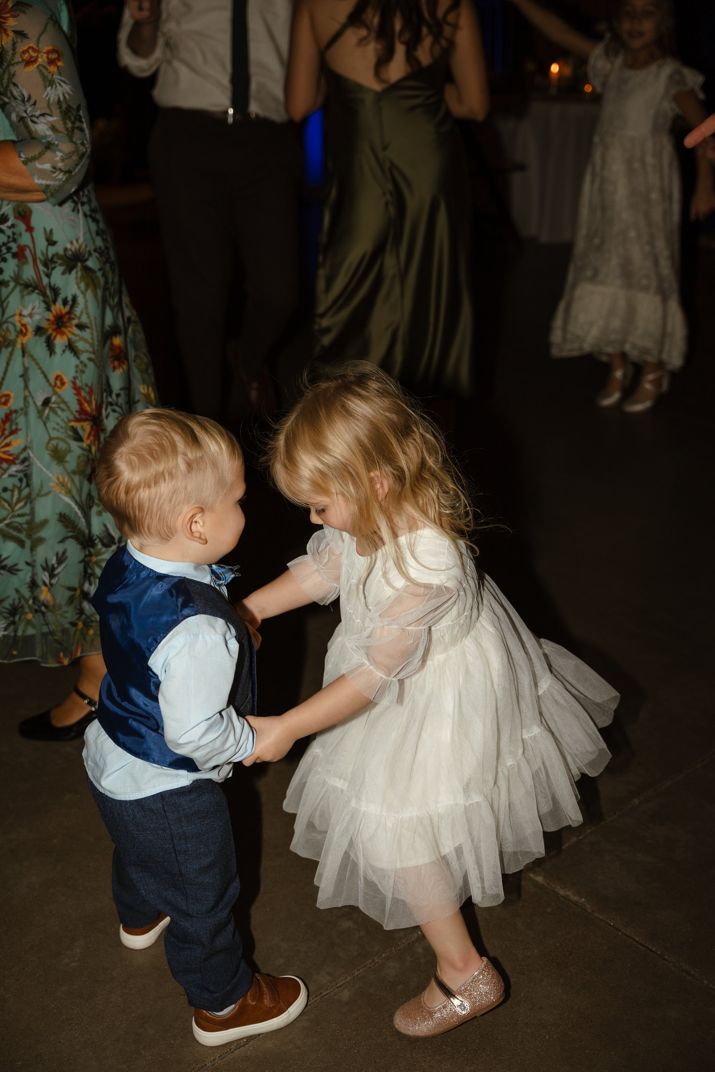 ring bearer and flower girl dancing 