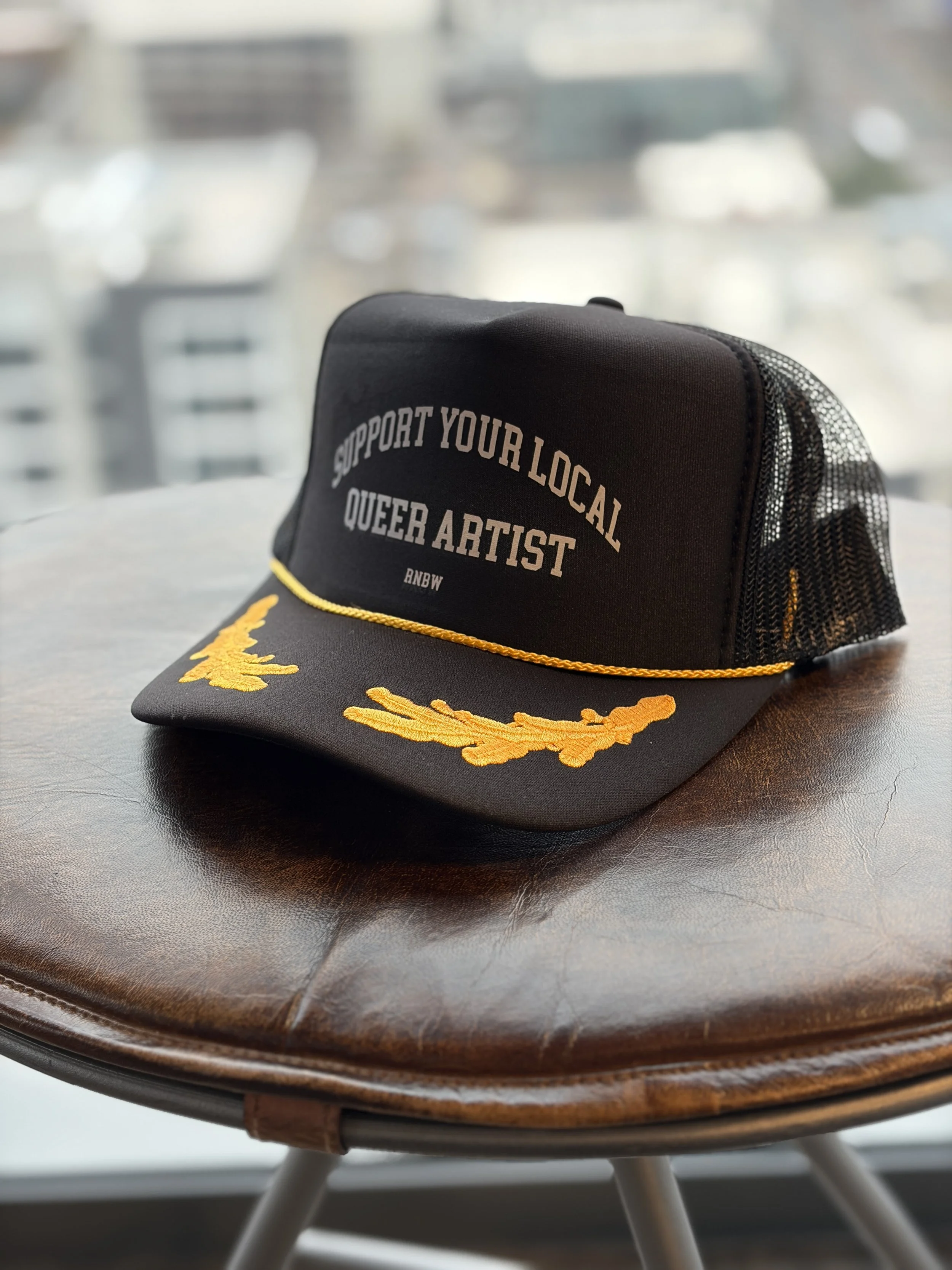 SUPPORT YOUR LOCAL QUEER ARTIST HAT 1 GAY.jpg