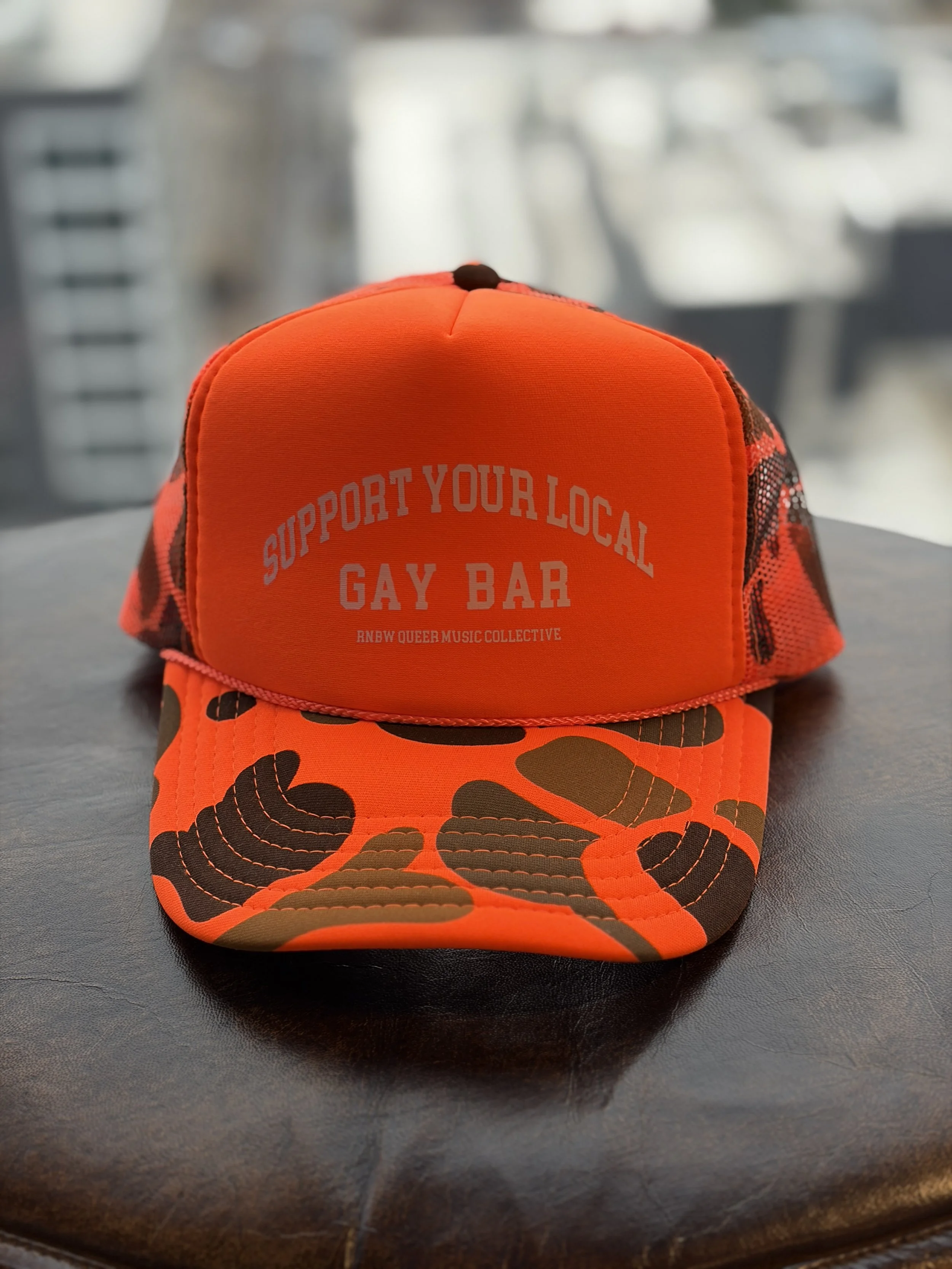 SUPPORT YOUR LOCA GAY BAR HAT ORANGE 1.jpg