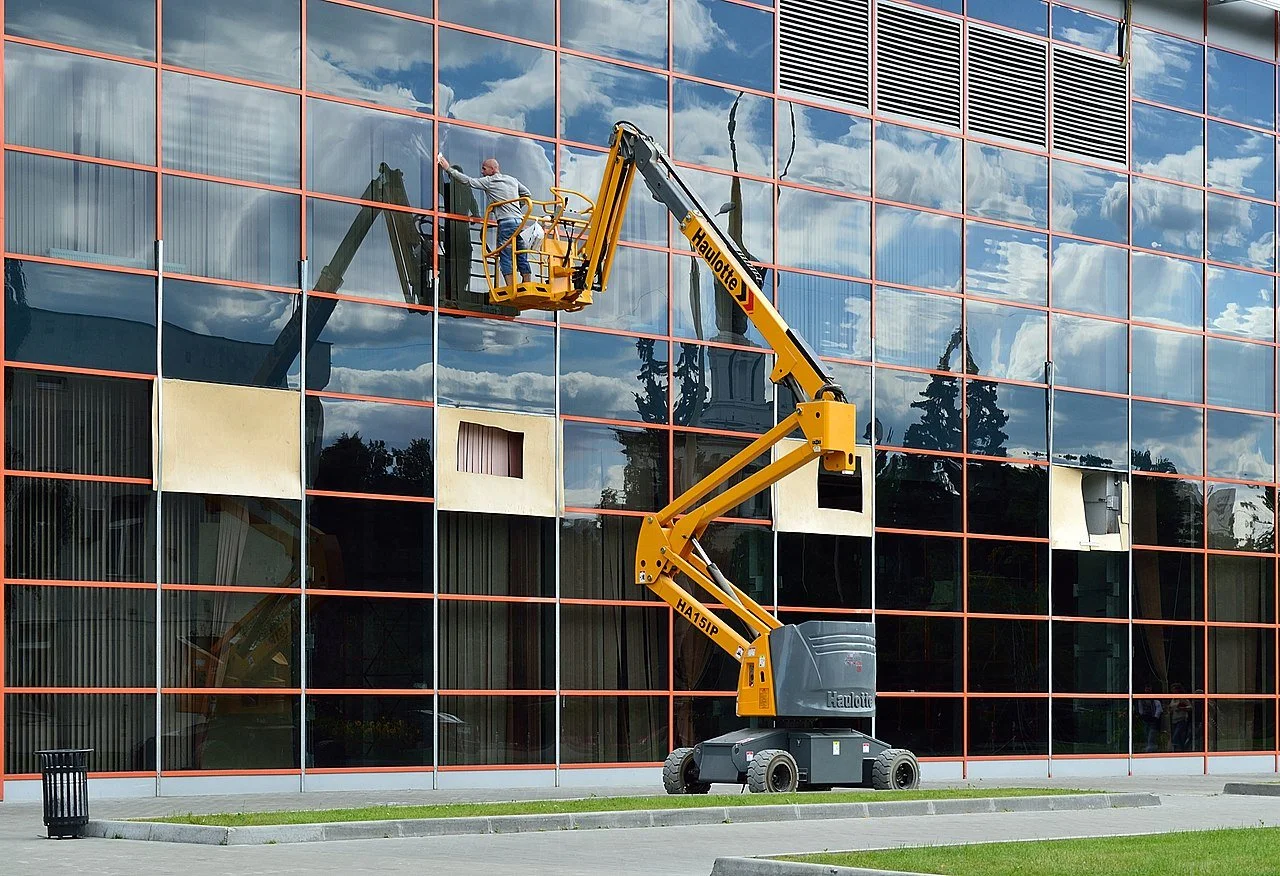 Commercial Office Building Having Windows Cleaned With Boom Lift