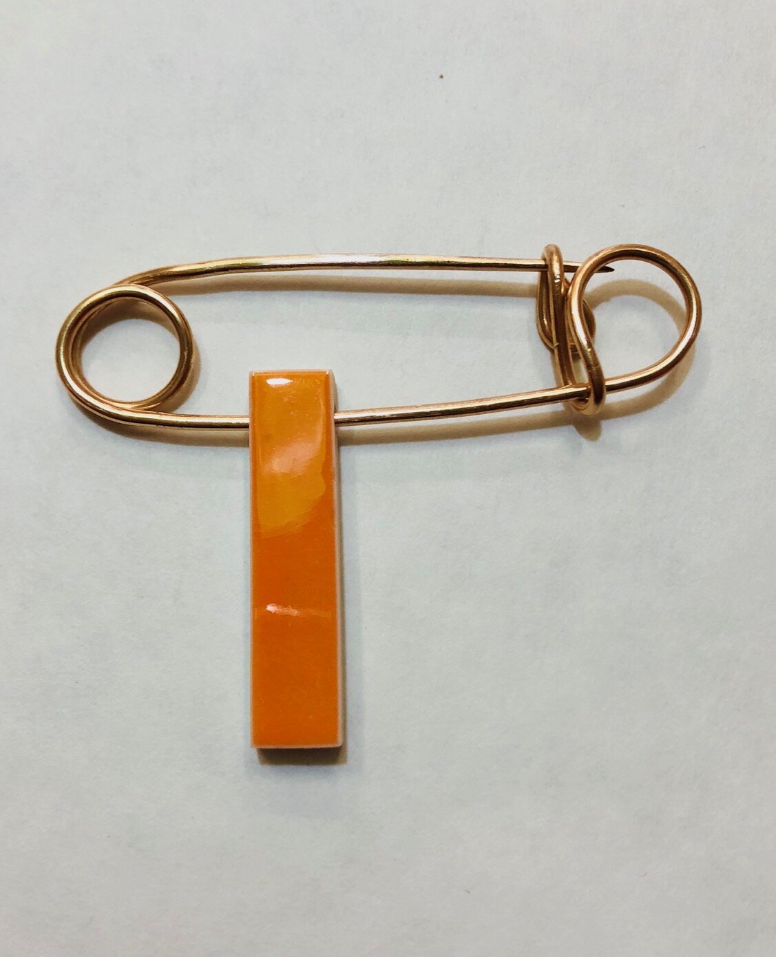 Bronze Safety Pin with Orange Charm, 2018
