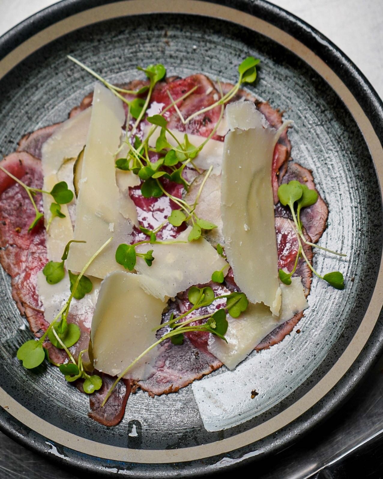 lamb carpaccio with shaved parmesan, arugula, and a black pepper rub (lamb iron chef menu)

-
In response to the new public health restrictions, we will be seating at a 50% limited capacity as of tomorrow. We highly recommend making a reservation by 