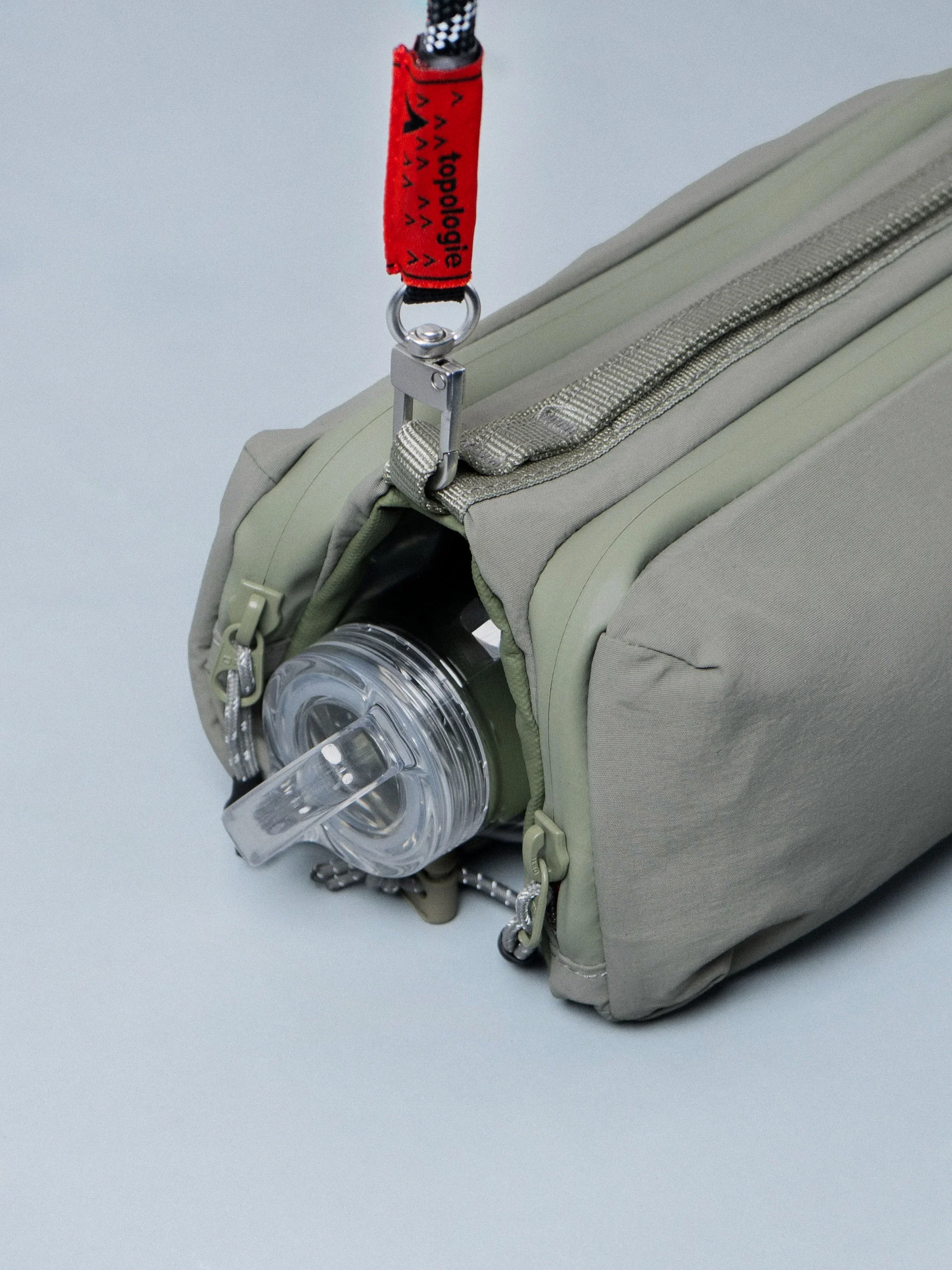 Sacoche bouteille Bottle Sacoche Medium Topologie Moss Papery vert kaki