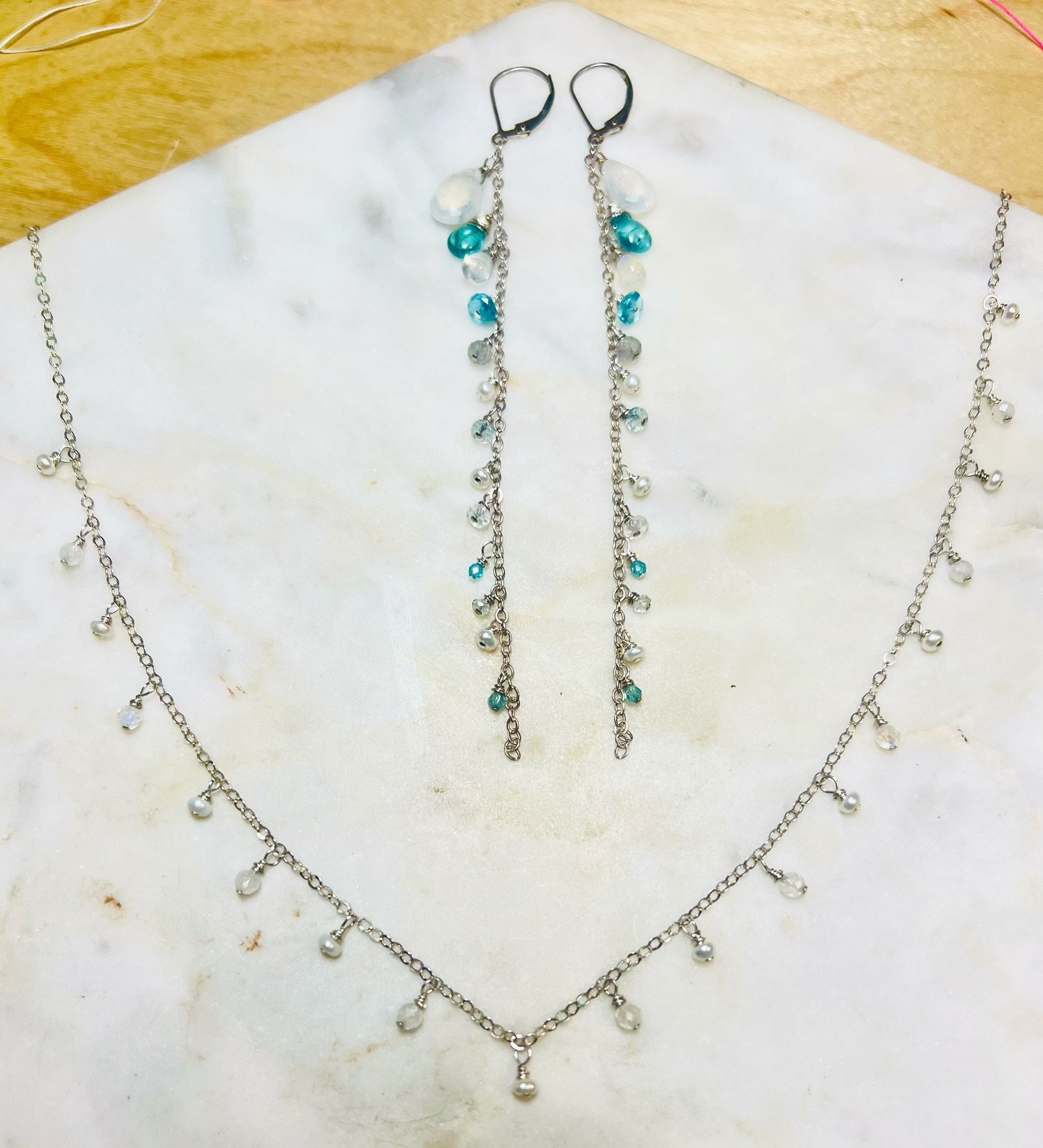 ✨ Embrace the Power of Manifestation ✨

Introducing our latest creation: Handmade with love by Lucy Hoven, our sterling silver pearl and moonstone necklace paired with dainty yet dramatic long earrings adorned with apatite accents. 💎✨

🌟 Dive into 