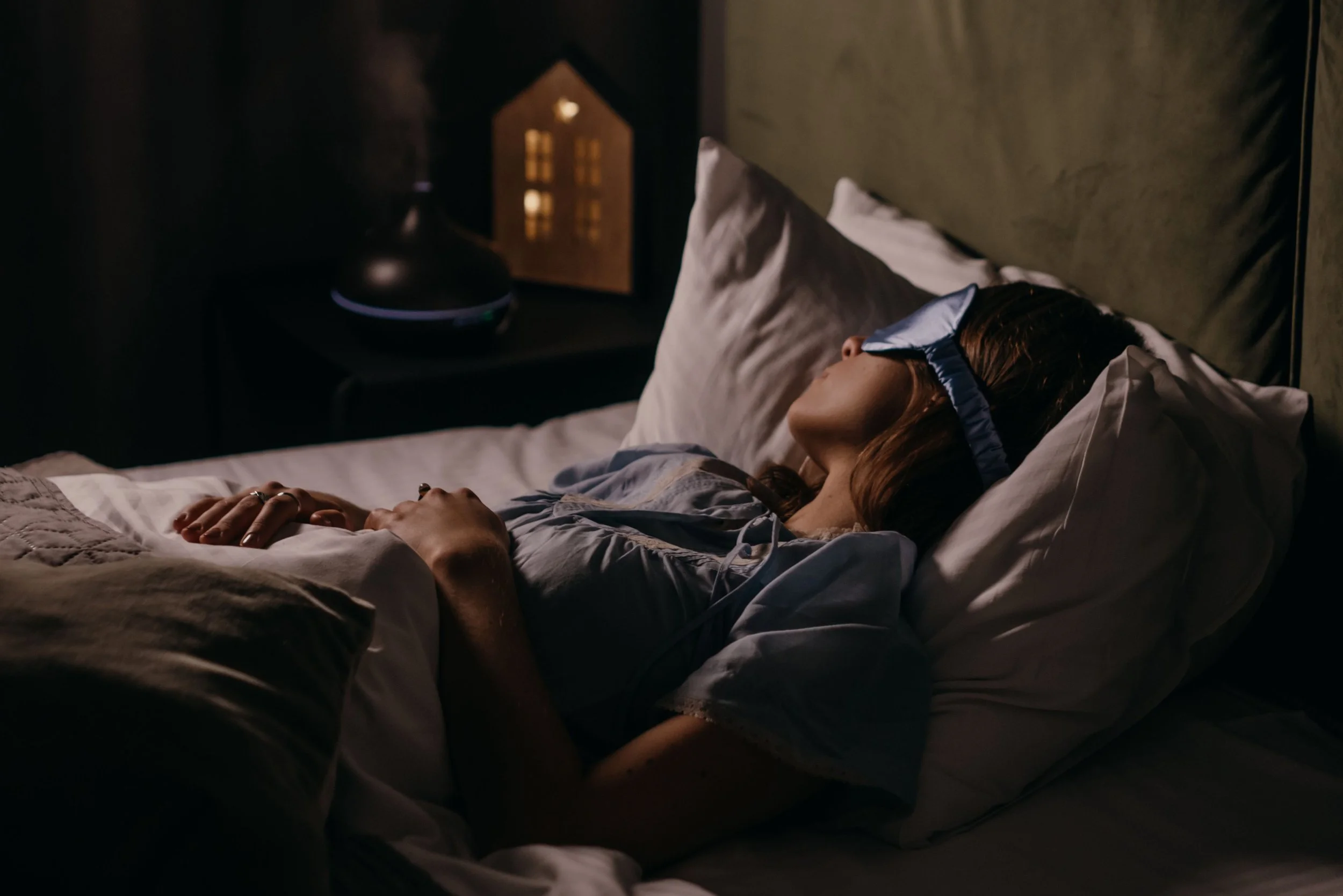 A midlife woman sleeping peacefully.