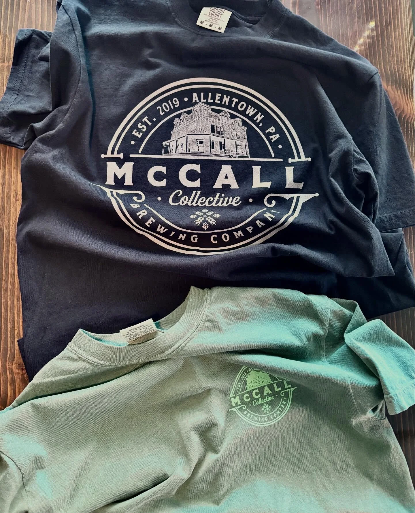 Hot off the press!
Fresh batch of @comfort_colors t-shirts!
Just in time for your holiday shopping needs. These high quality black and light green McCall branded shirts make the perfect gift. 
Pair it with a glass, 4pk and/or gift card - and now we&r