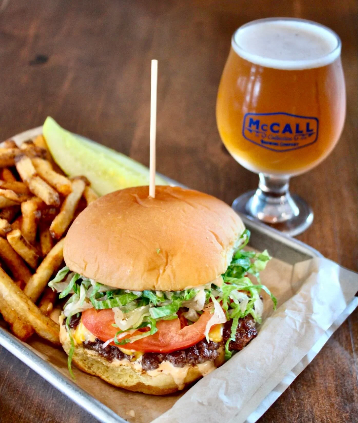 Just a real good smash burger 😍

No frills - beef smash patty, LTO, and house smash sauce on a potato bun. 
*chefs kiss* 

SO GOOD 

Oh and only $10 with fries every Monday to Friday open to close

Available BOTH spots 🙌