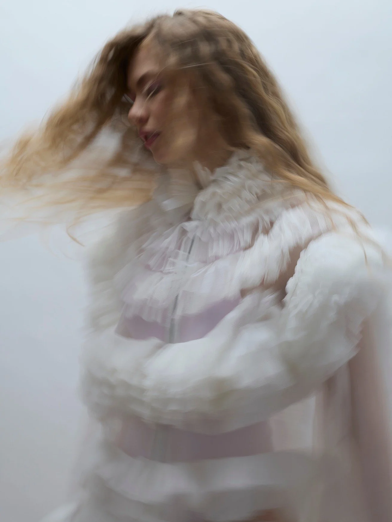 Ruffled tulle blurs into motion, turning softness into a clear brand code&mdash;light, modern, assured. That&rsquo;s our approach at Couture Consultancy: we translate aesthetics into strategy, define positioning and visual language, then produce asse
