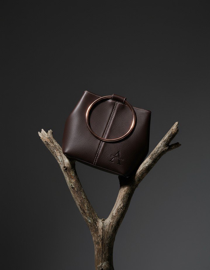 Real bag, imagined world. For this visual, we kept the product photography completely authentic and used AI only in the background. The result is a scene that feels cinematic yet true to the craftsmanship of the bag &ndash; extending its story withou