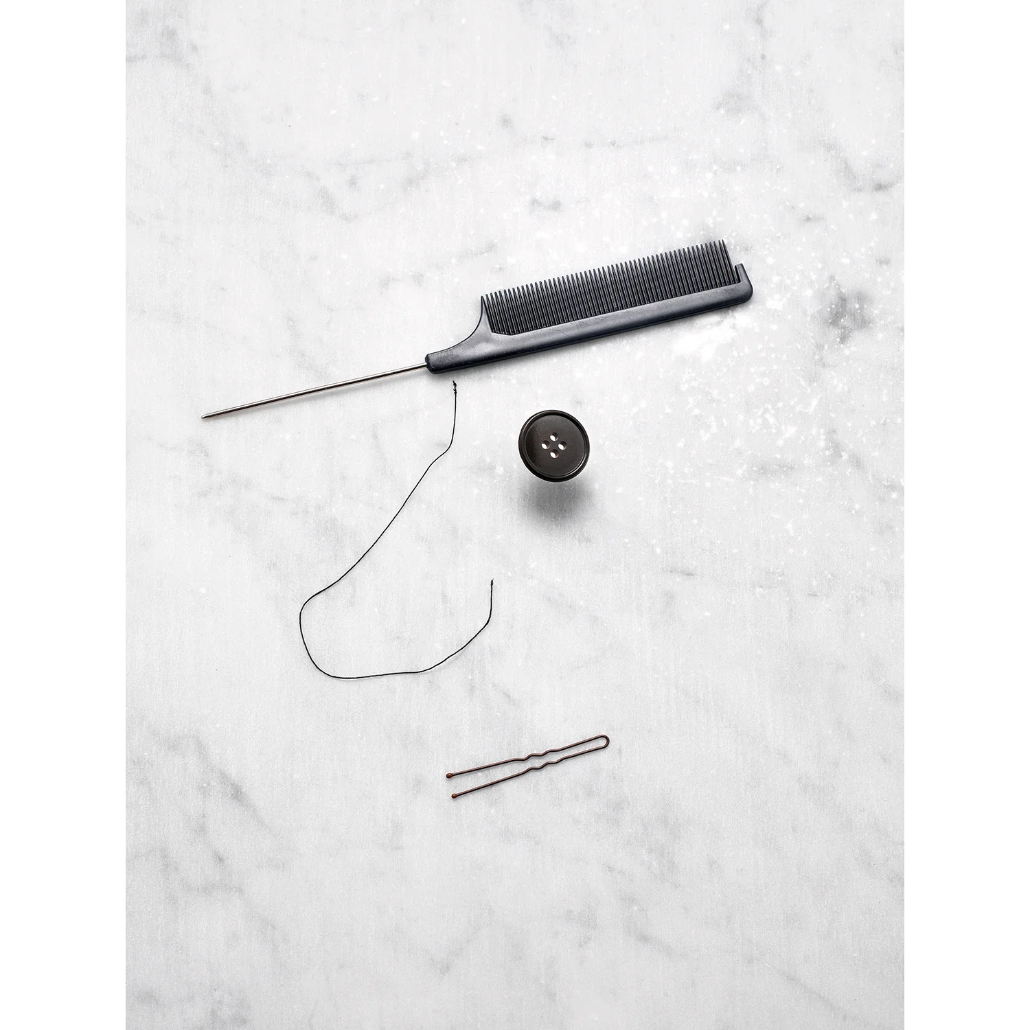 Comb, flying button, thread and bobby pin - face