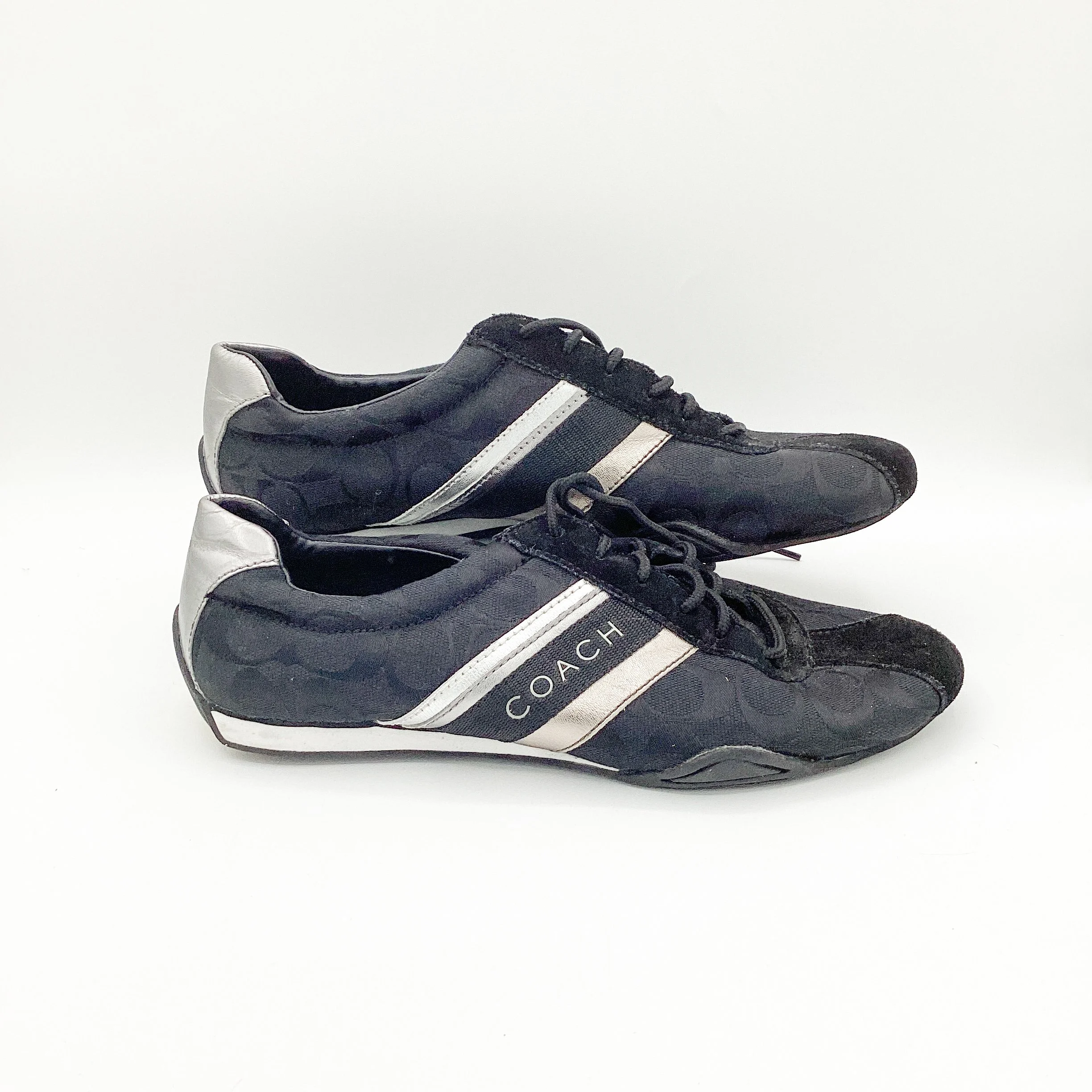 black adidas with silver stripes