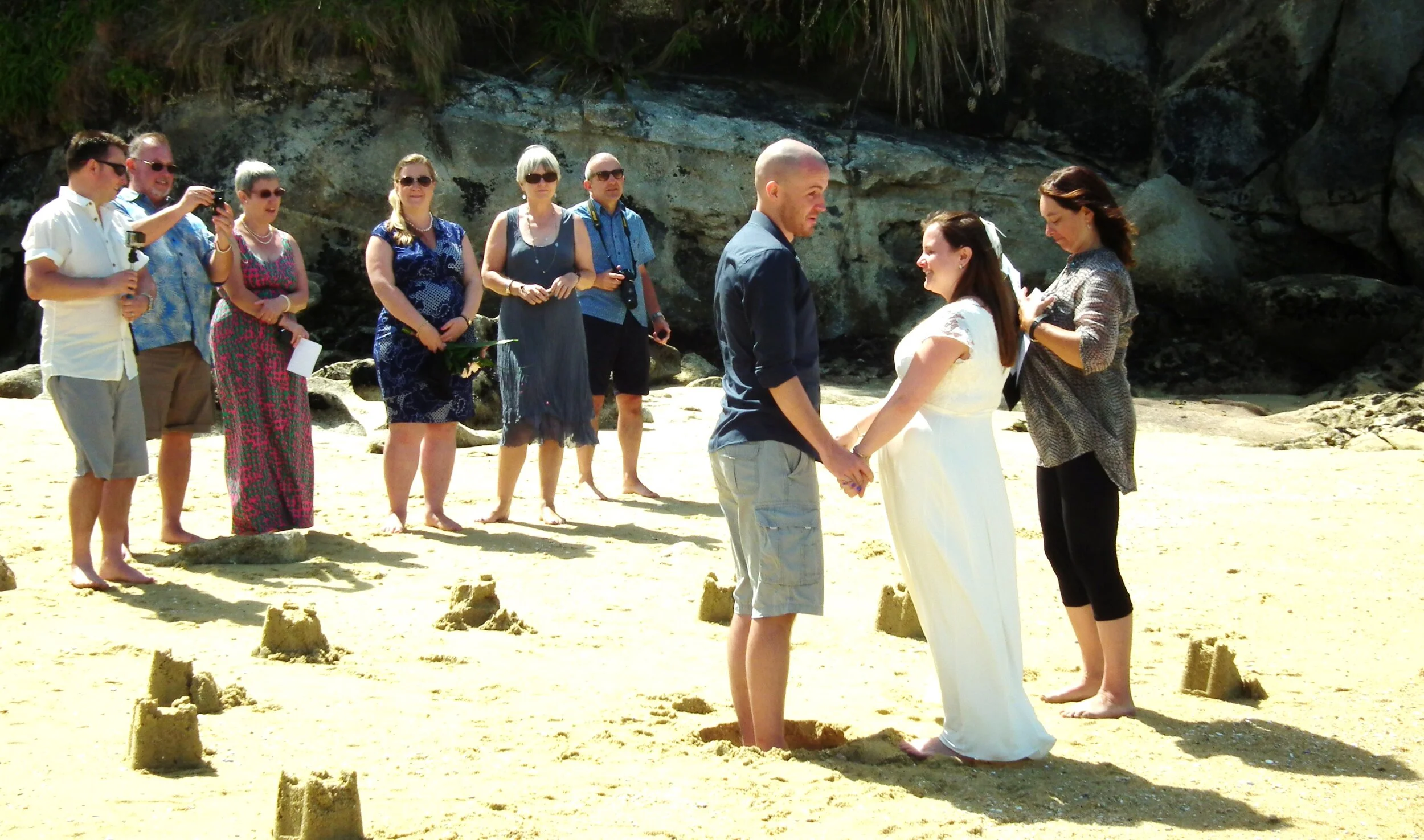 Buckets and Spades, check out the whole in the ground to make the groom shorter LOL!