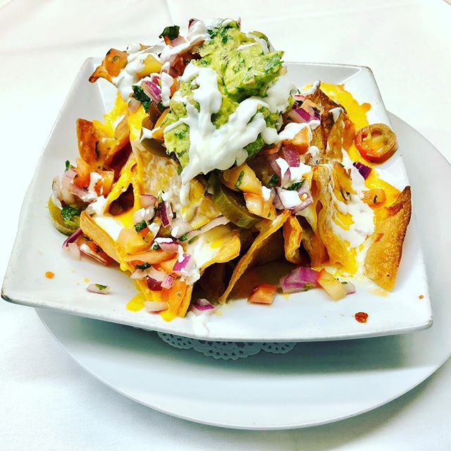 Nachos Salad: Corn Tortilla Chips, Melted Mozzarella and Cheddar Cheeses, Guacamole Pico De Gallo, Sour Cream, Sliced Jalapeno