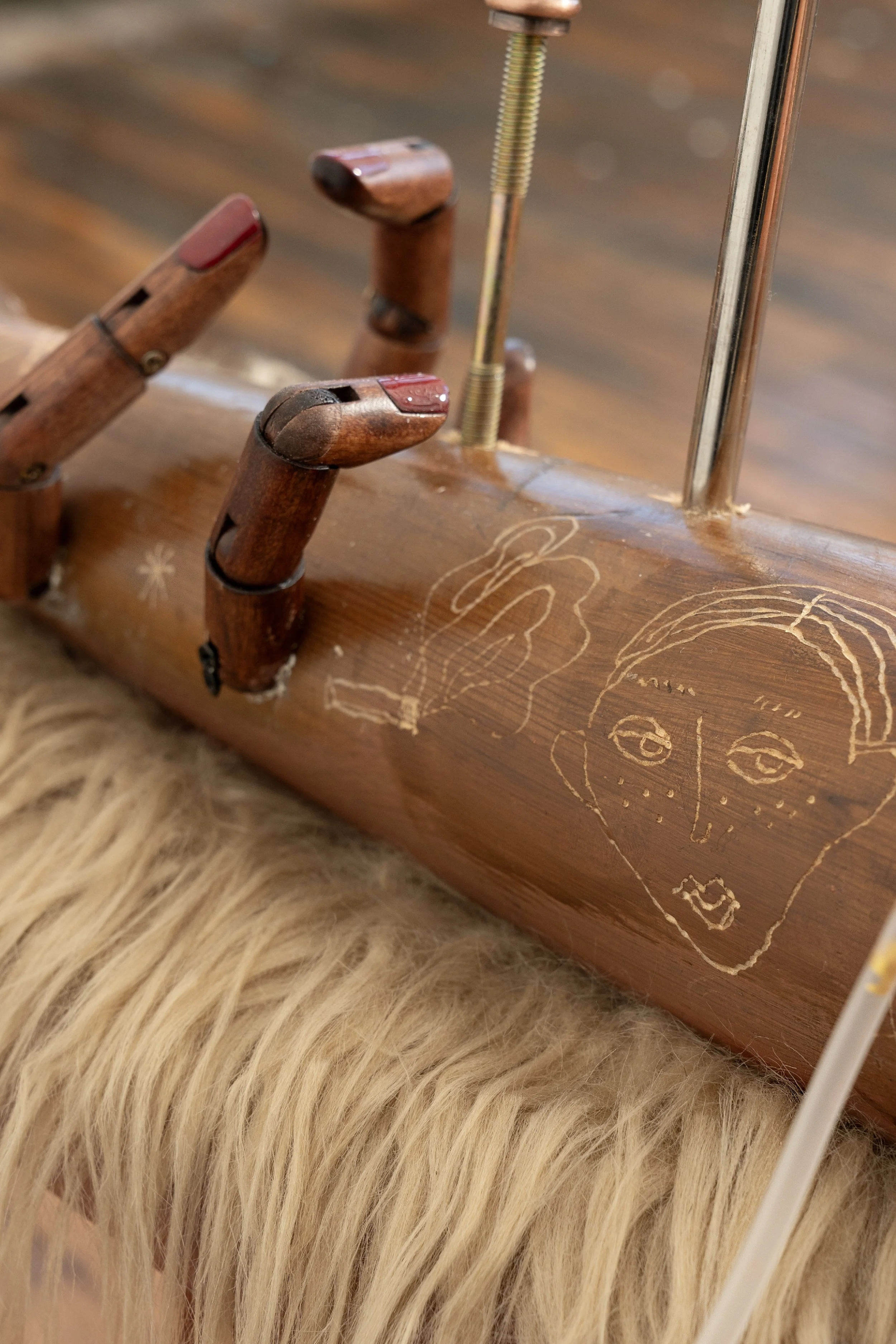   Dream Sipper   2025, Stone clay, wooden stool, fur fabric, gemstone, wooden table leg, wooden mannequin finger, wooden shoe expander, acrylic, string, IV line, glass bottle, and ribbon, 35×20x70inches. 