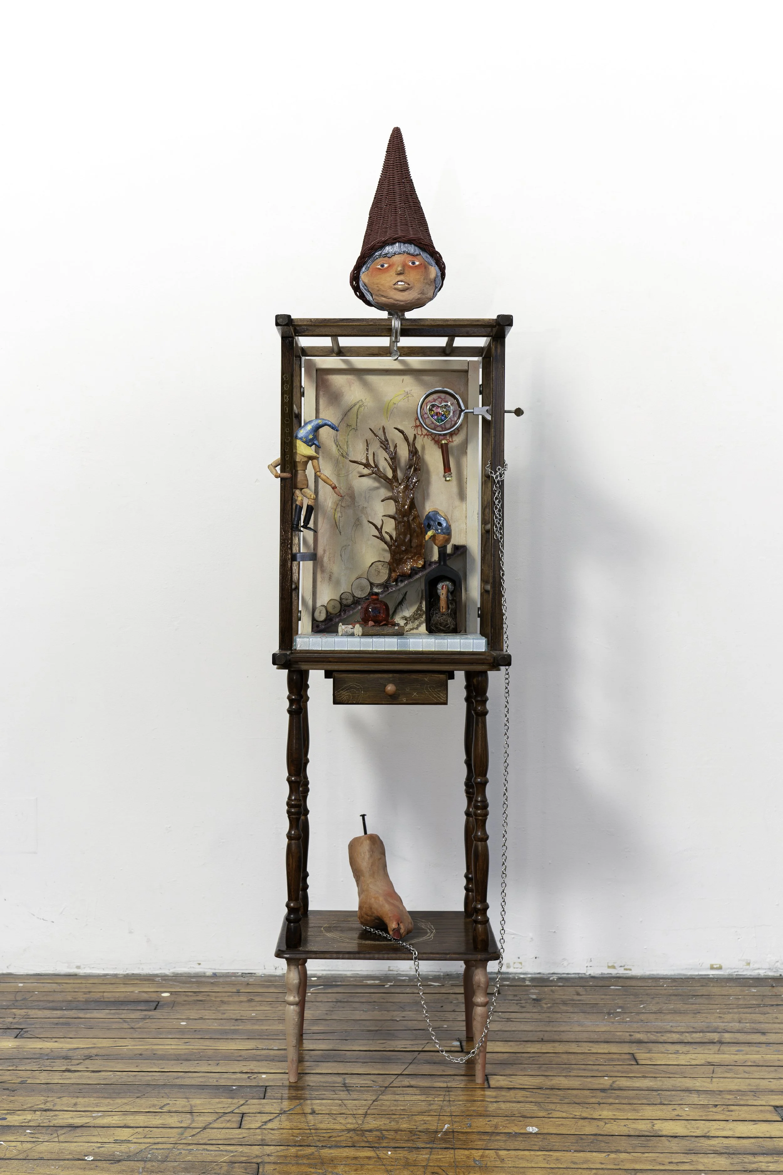    Lured by Red  , 2025 Stone clay, crib, bedside table, found objects, and acrylic 20 × 15 × 60 inches 
