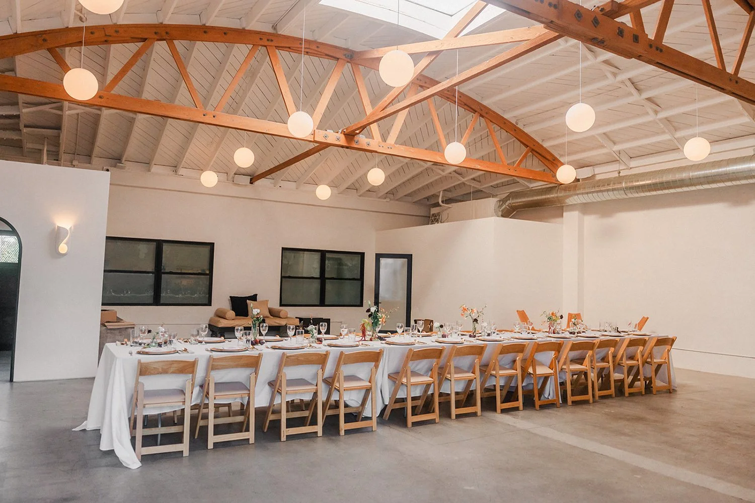 Lacuna seated dinner bow truss ceiling event Los Angeles