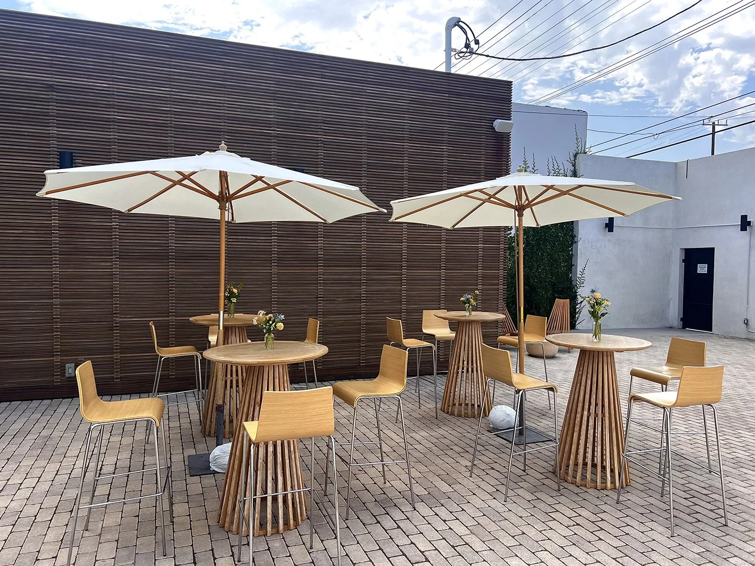 Lacuna outdoor courtyard dining tables umbrella natural light Los Angeles