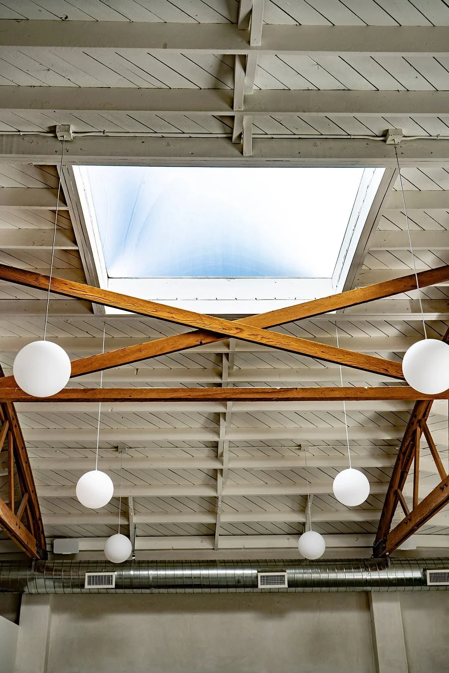 Lacuna 18 foot bow truss ceiling with skylight built by Verde LA general contractor West Adams Los Angeles