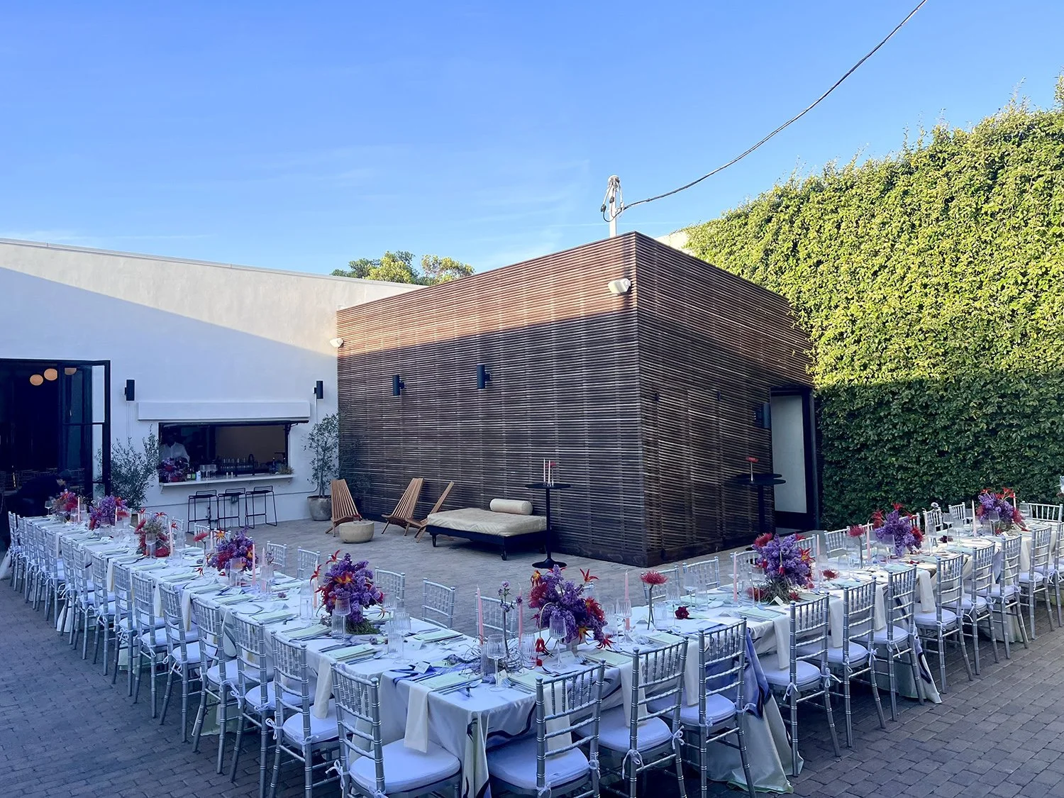Lacuna outdoor wedding ceremony green wall aisle Los Angeles