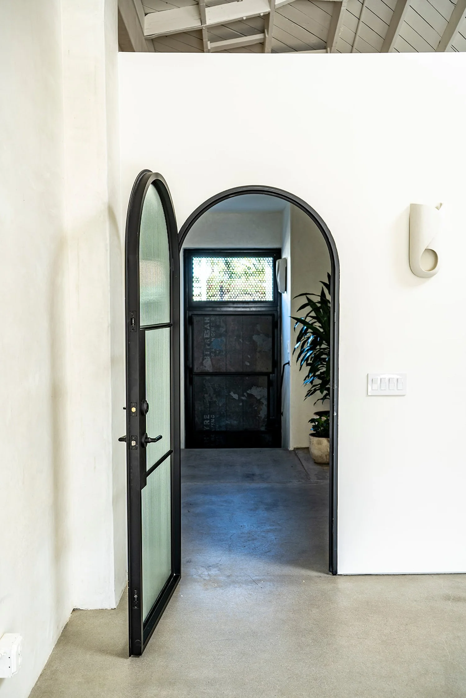 Lacuna arched entry door street facing exterior Los Angeles