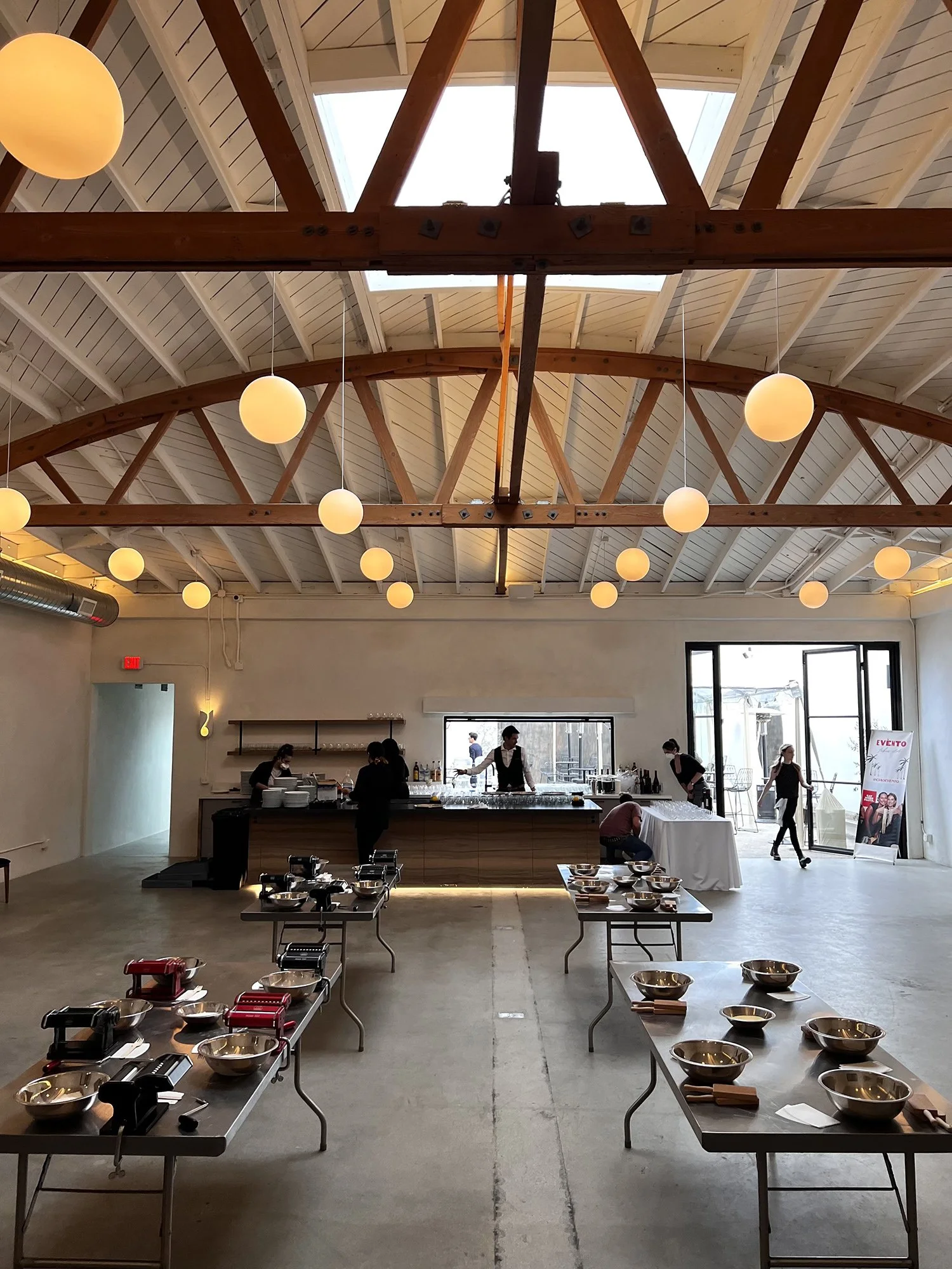 Lacuna nighttime indoor event bow truss ceiling warm lighting West Adams Los Angeles