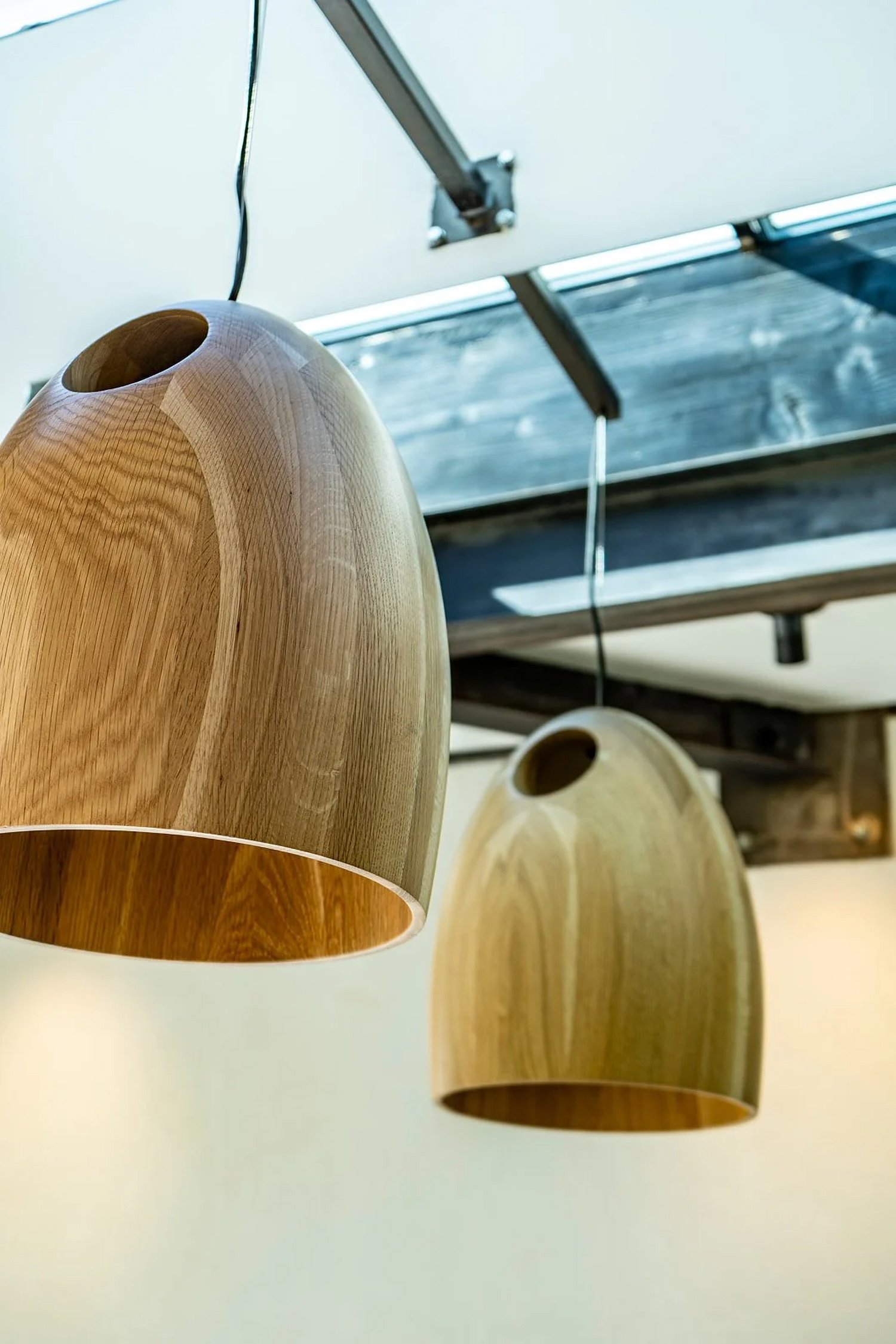 Solid oak pendant lights by Ross Gardam via Twentieth Los Angeles installed at Lacuna West Adams