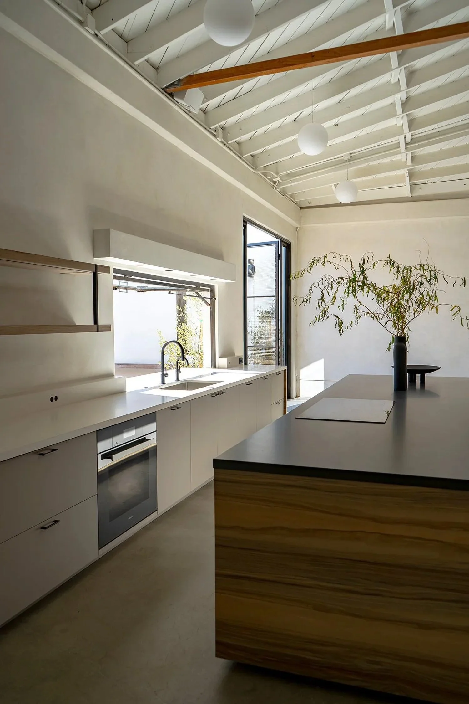 Lacuna custom kitchen with Miele appliances including induction cooktop and integrated dishwasher Los Angeles
