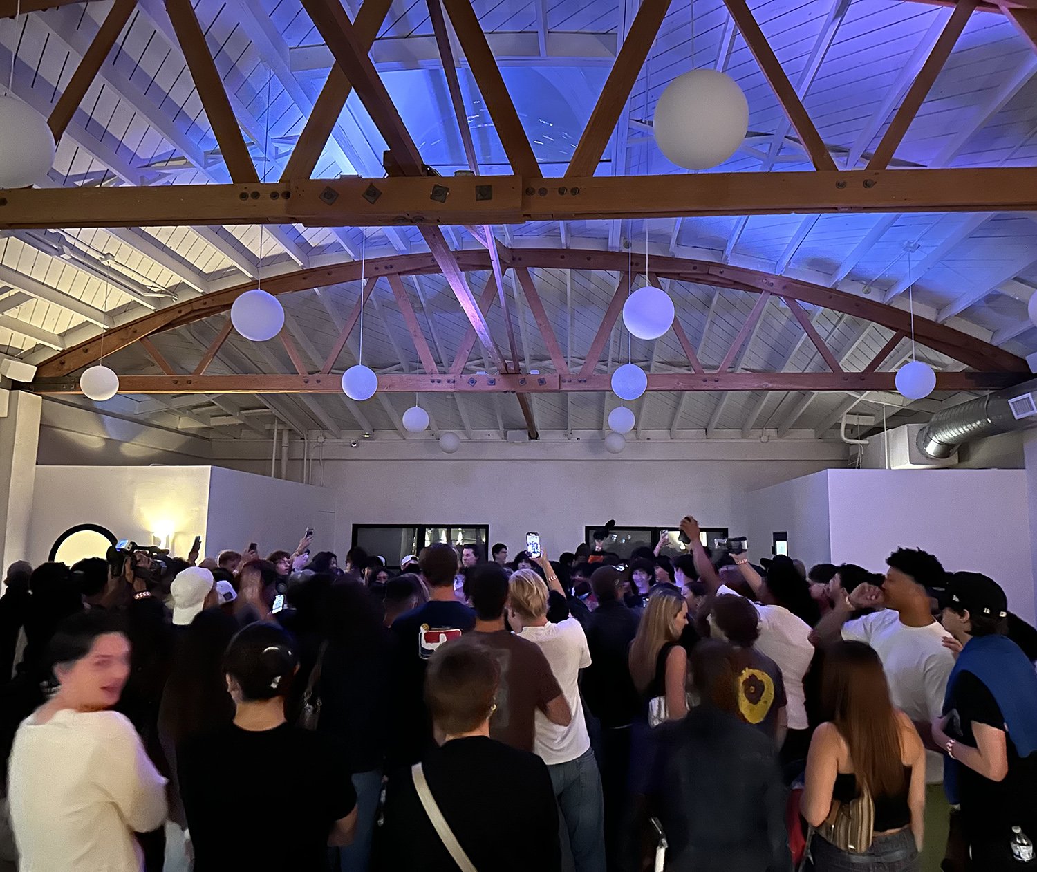 Lacuna nighttime crowd event indoor purple lighting West Adams Los Angeles