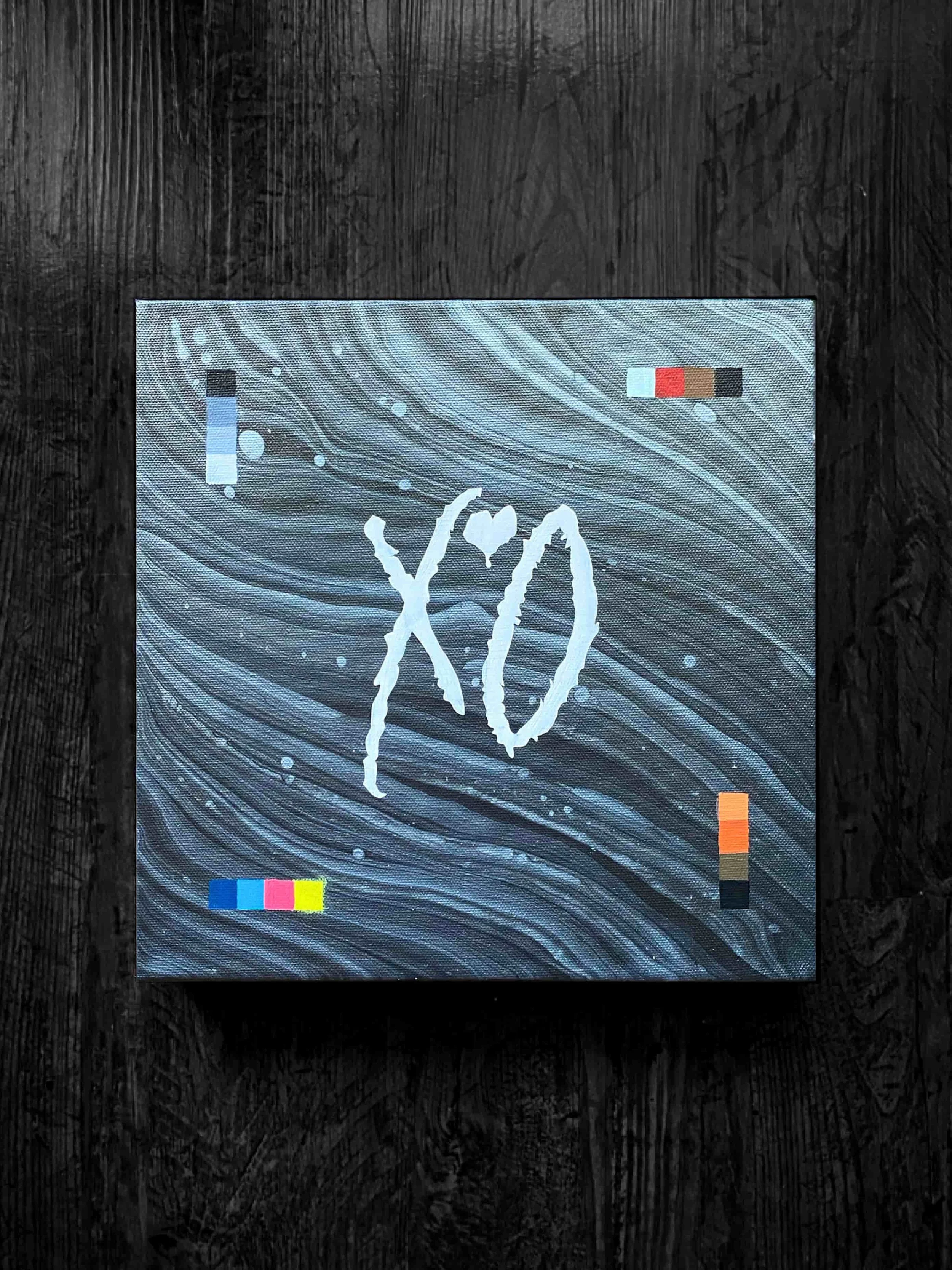  Custom XO acrylic artwork featuring gray fluid marbled textures, expressive white lettering, and colorful modern accent details 