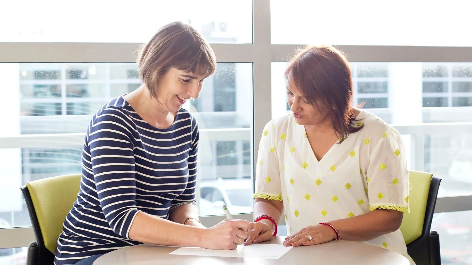 Usha helping to guide a landlord