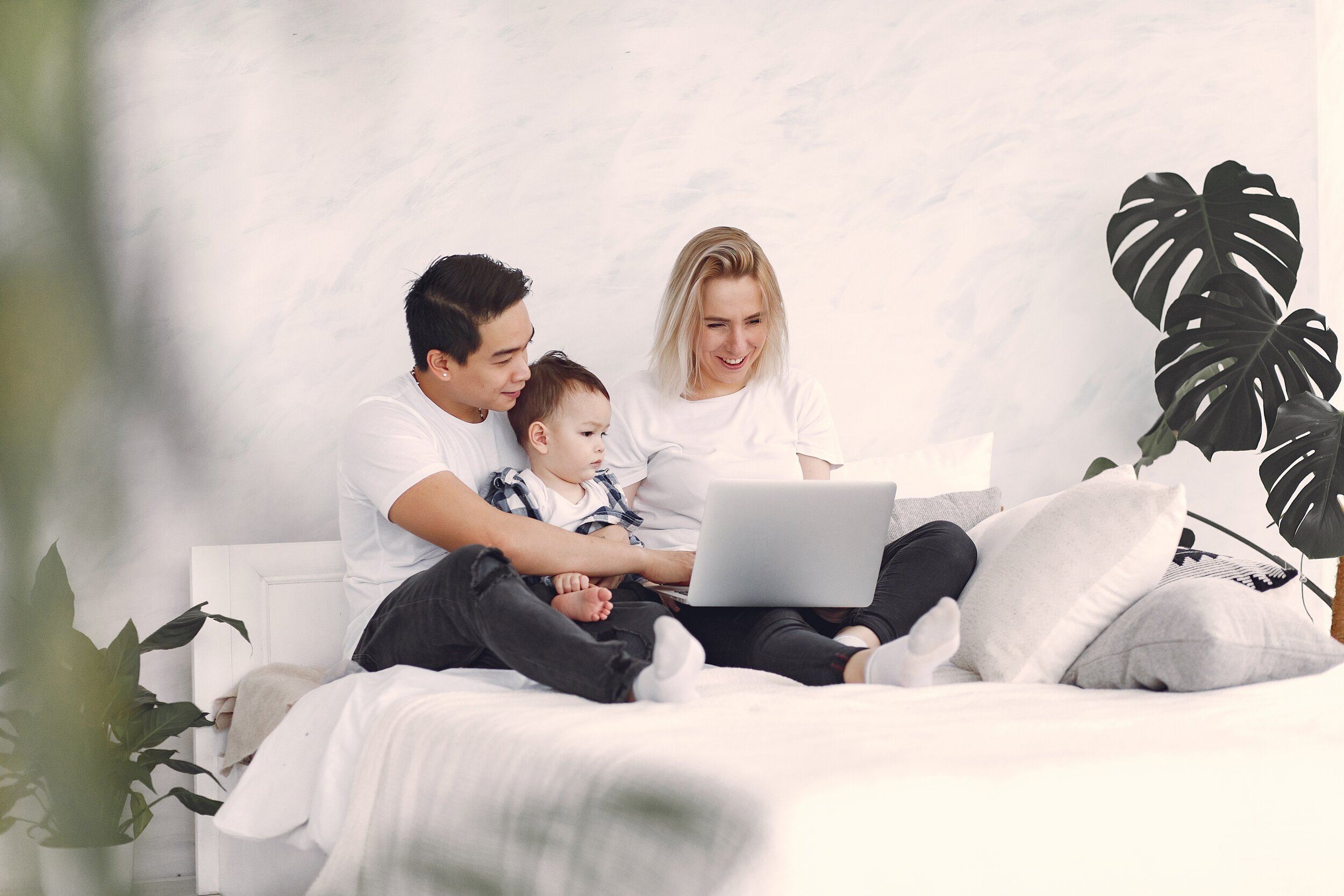 man-and-woman-sitting-on-white-bed-using-laptop-computer-3912387.jpg
