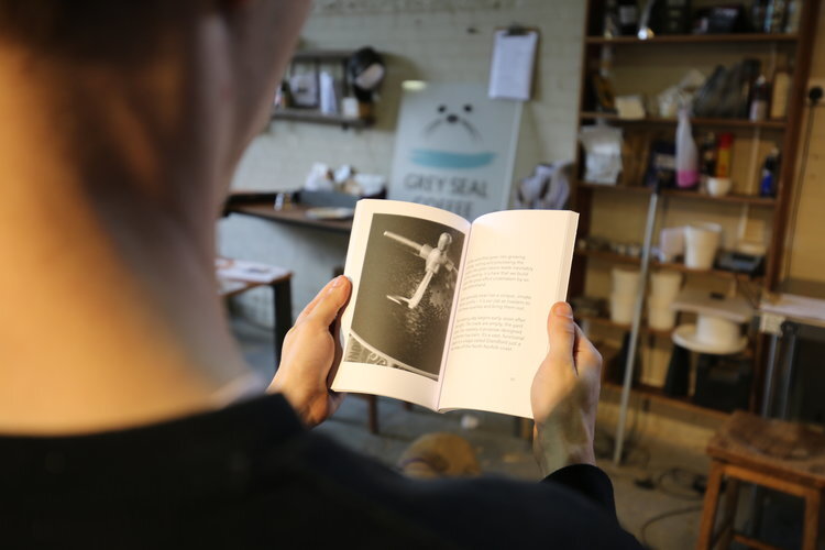 Grey Seal Roaster Ben reading our Real Coffee book