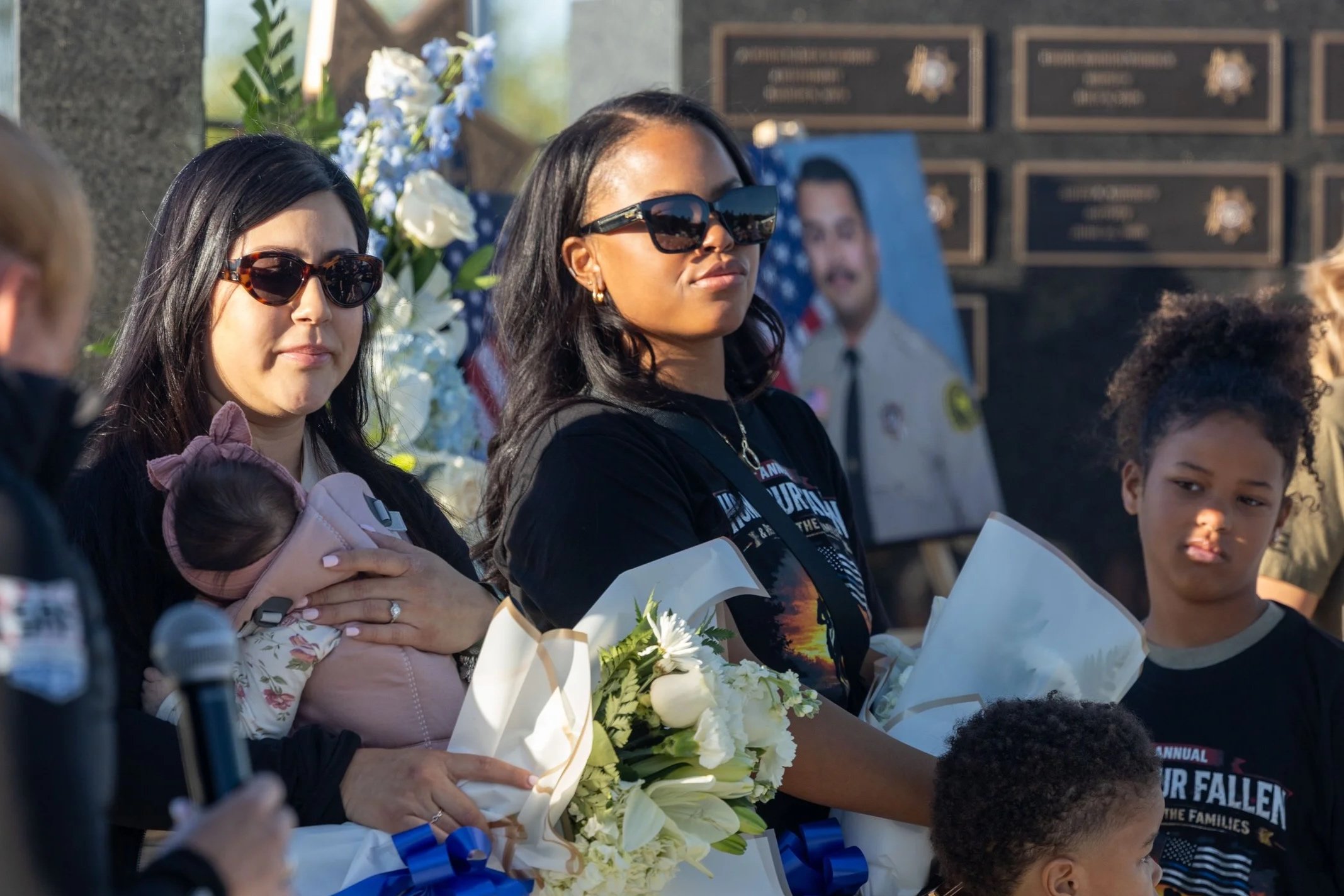 Surviving spouses and family members of Deputies Andrew Nunez and Hector Cuevas Jr. honored at the SEBA Honor Our Fallen 5K memorial event
