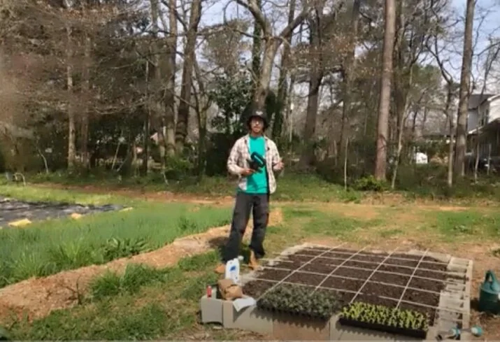 Demetrius Milling demonstrating how to grid off your raised bed. Photo from Spring Forward.