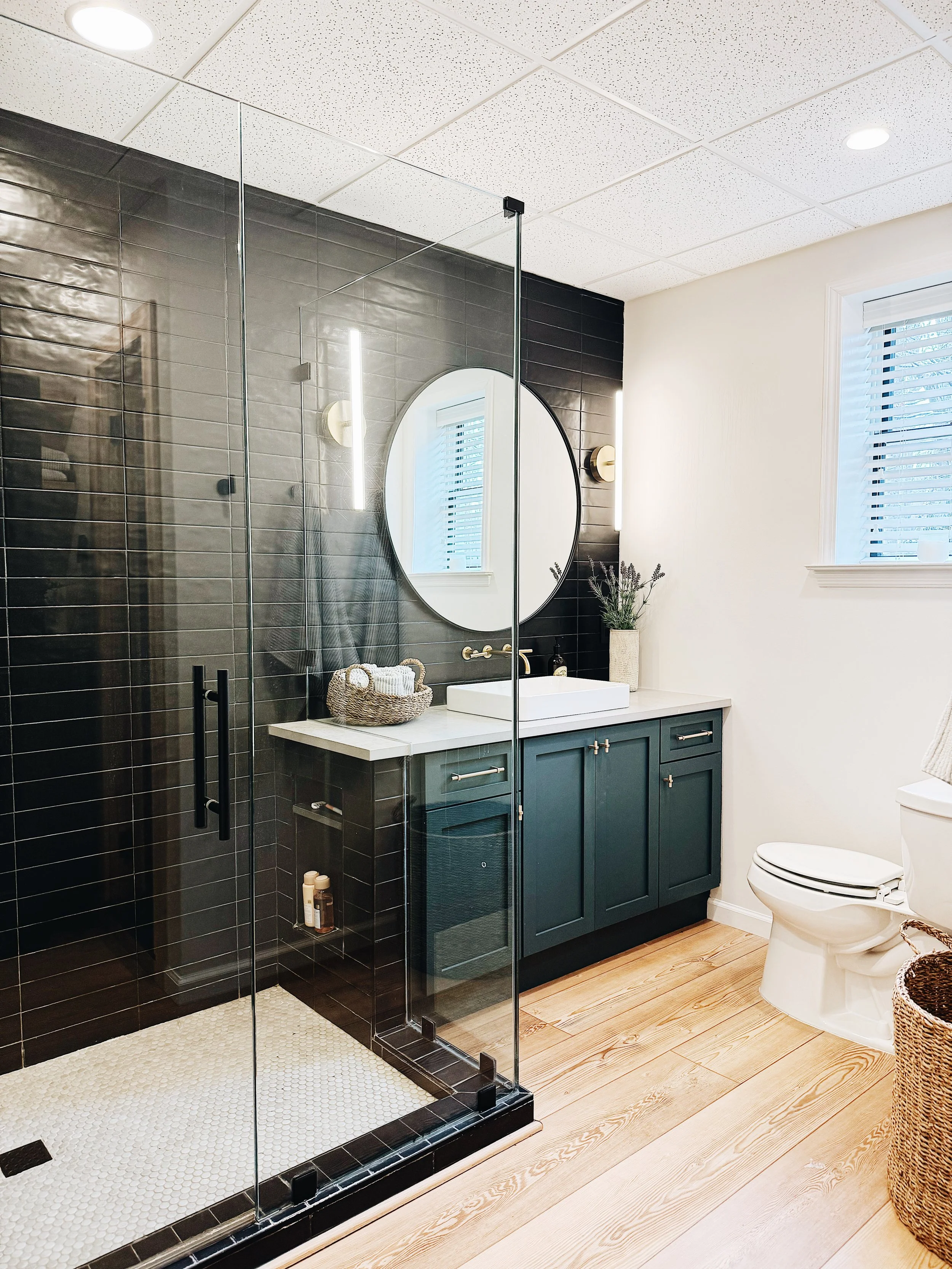 Bathroom makeover Birmingham AL — new shower tile, vanity update, and fixture refresh by Canebrake Construction
