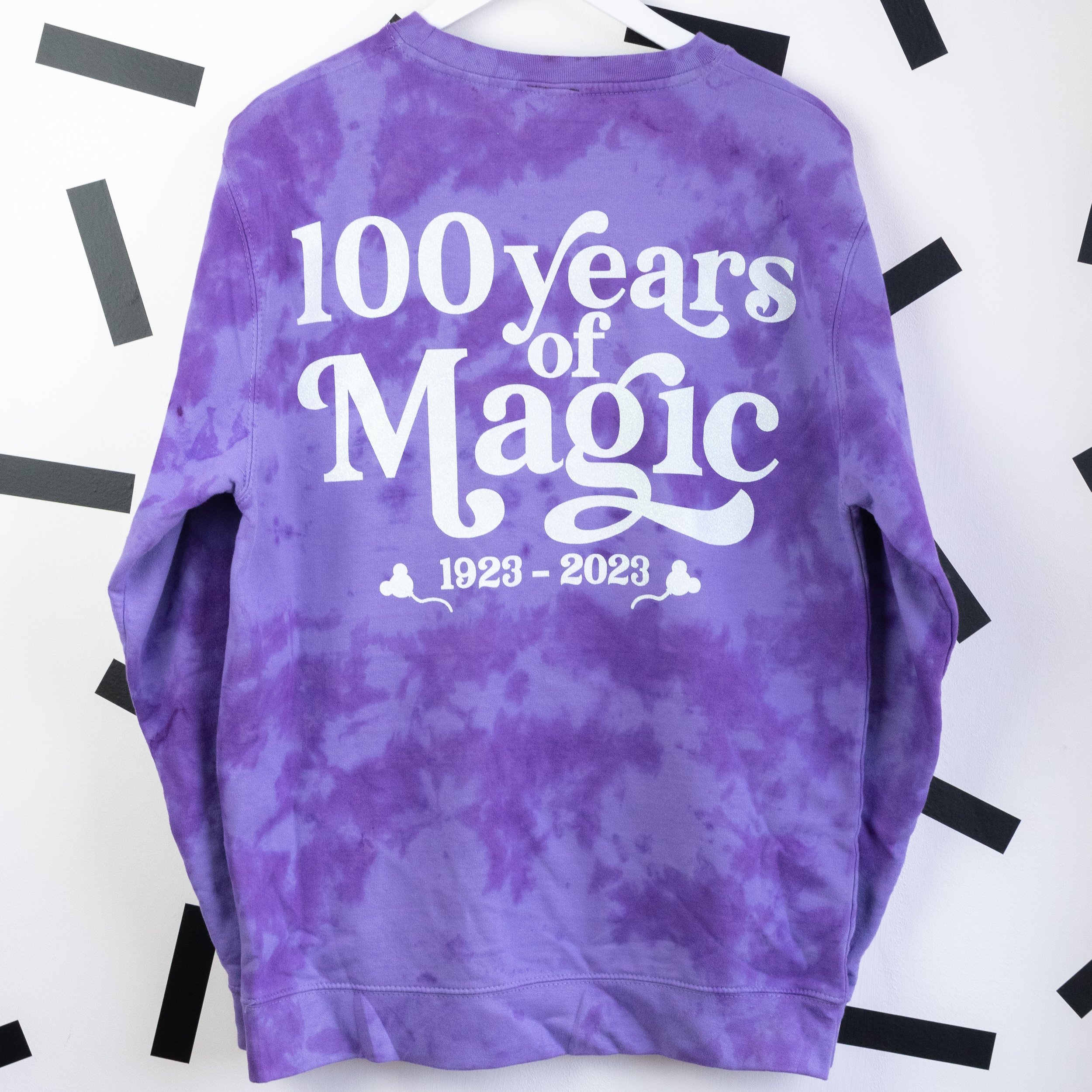 Disney-100-years-of-wonder-purple-tie-dye-jumper-men-women.jpg