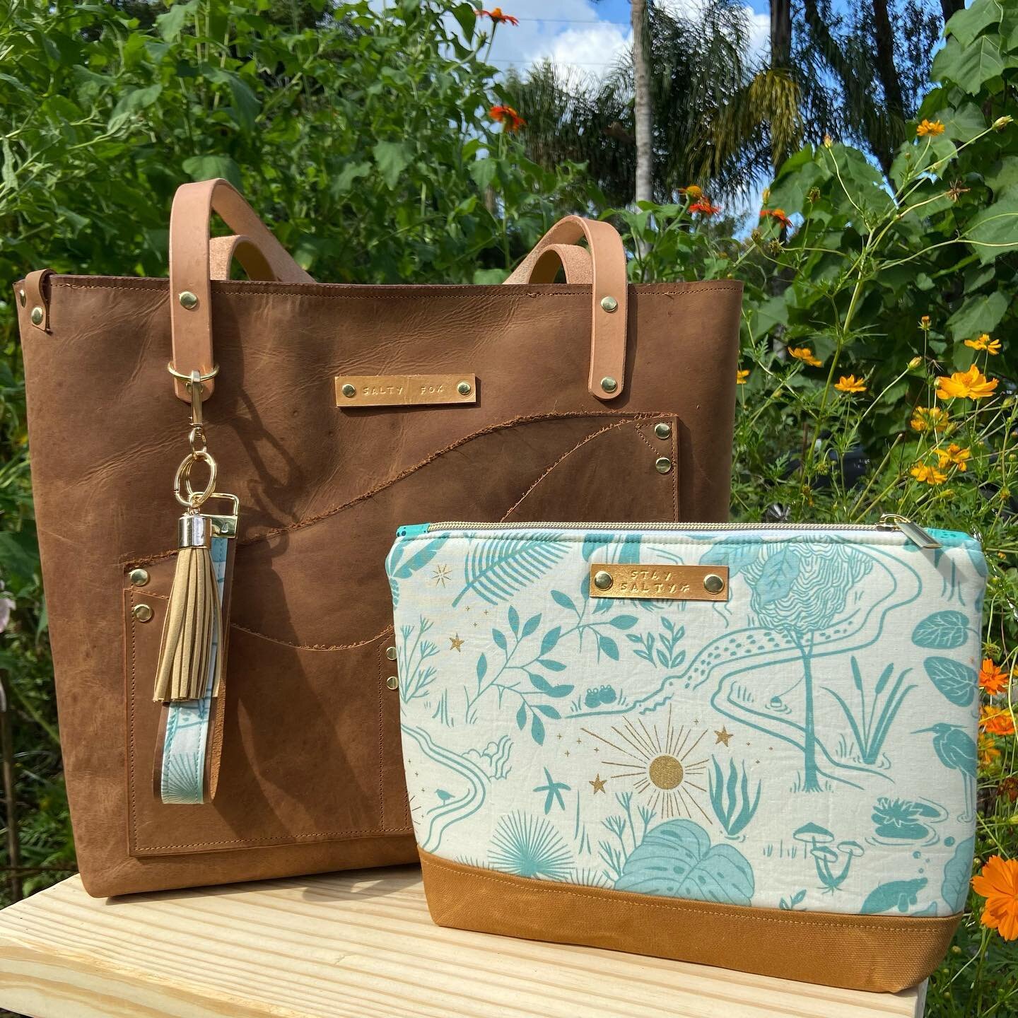 This past summer I helped a friend sell her house and move out of state. As a thank you for using me as her Realtor I made her a custom leather bag with the most stunning Florida fabric, so she would always have a bit of home with her on her new jour