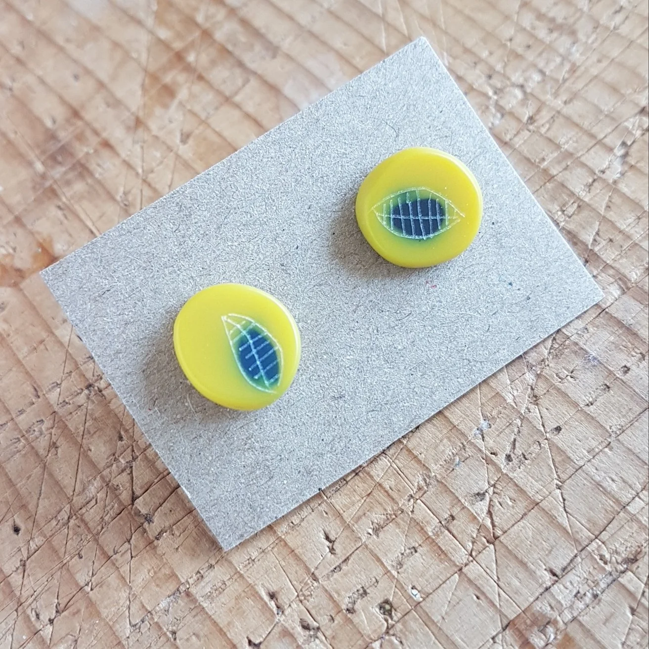 yellow and dark grey mini round studs