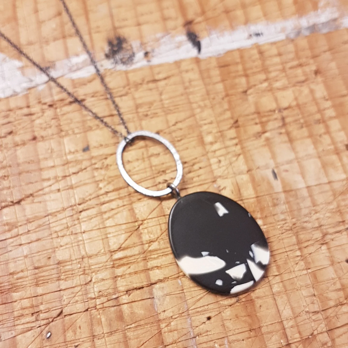 black and cream small oval pendant with link