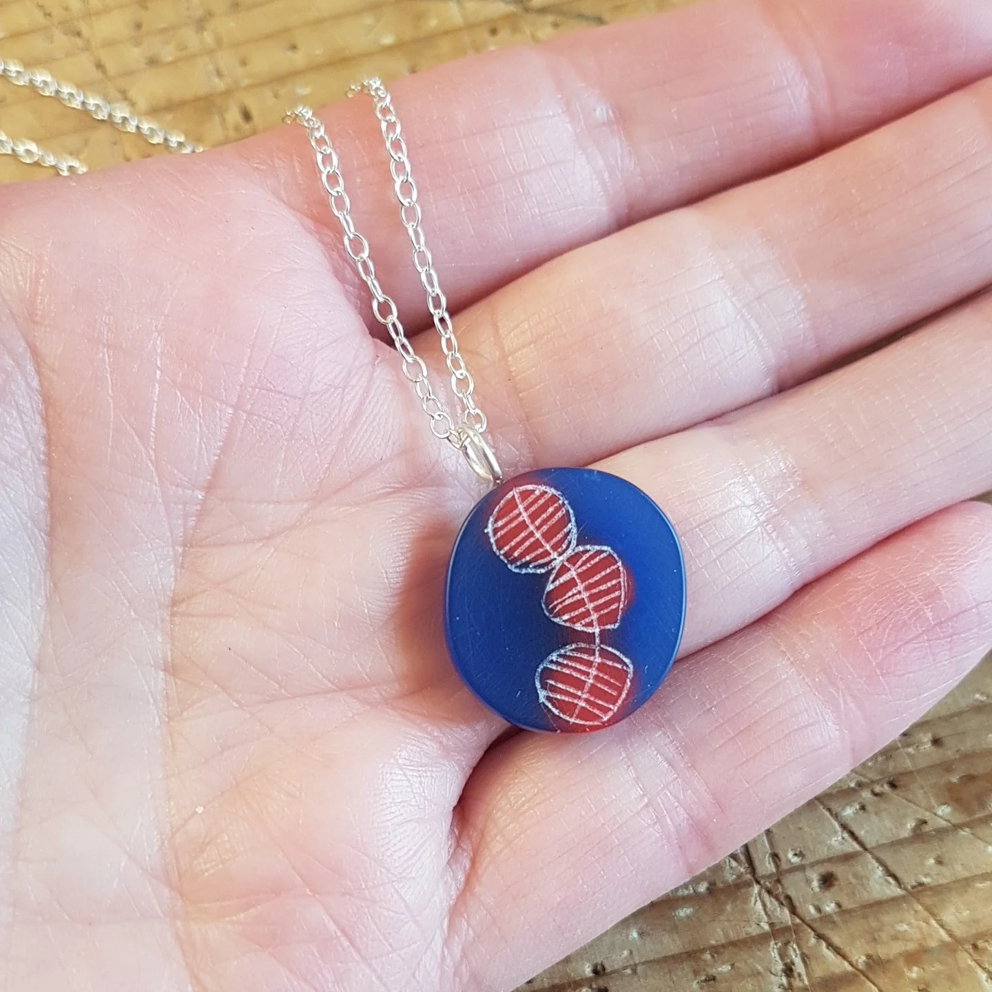 blue and red round pendant