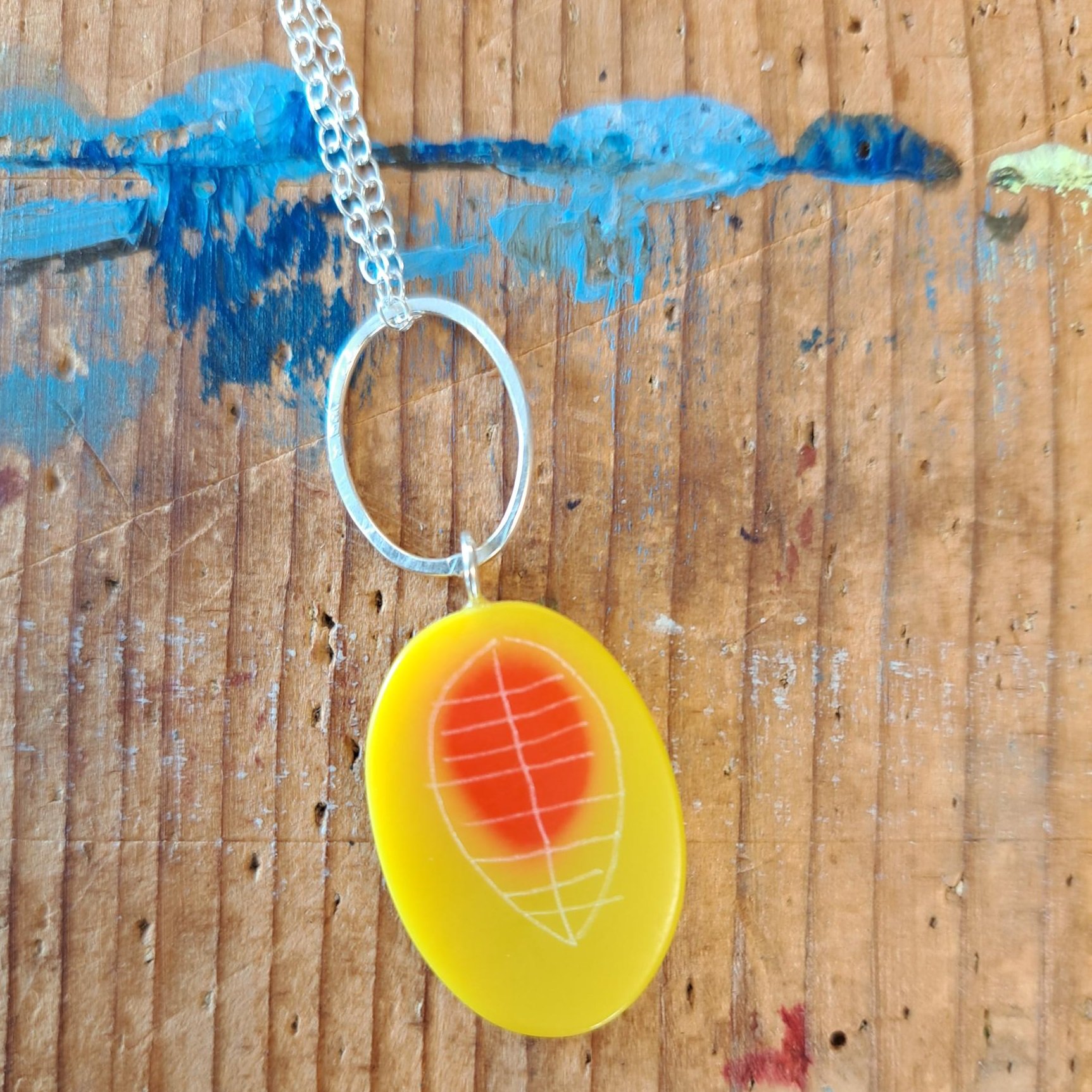 yellow and orange little oval pendant with link