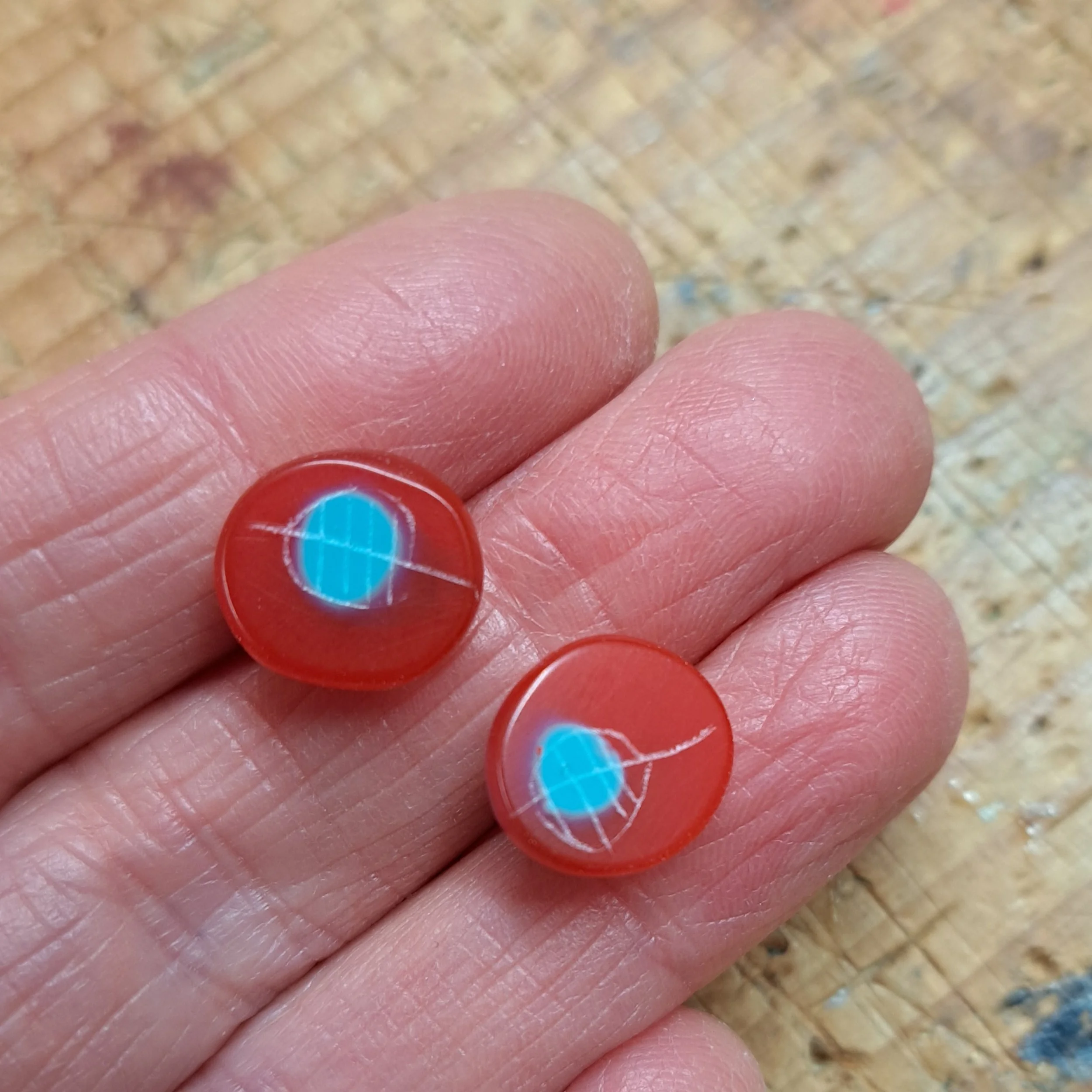 Translucent red and turquoise mini round studs