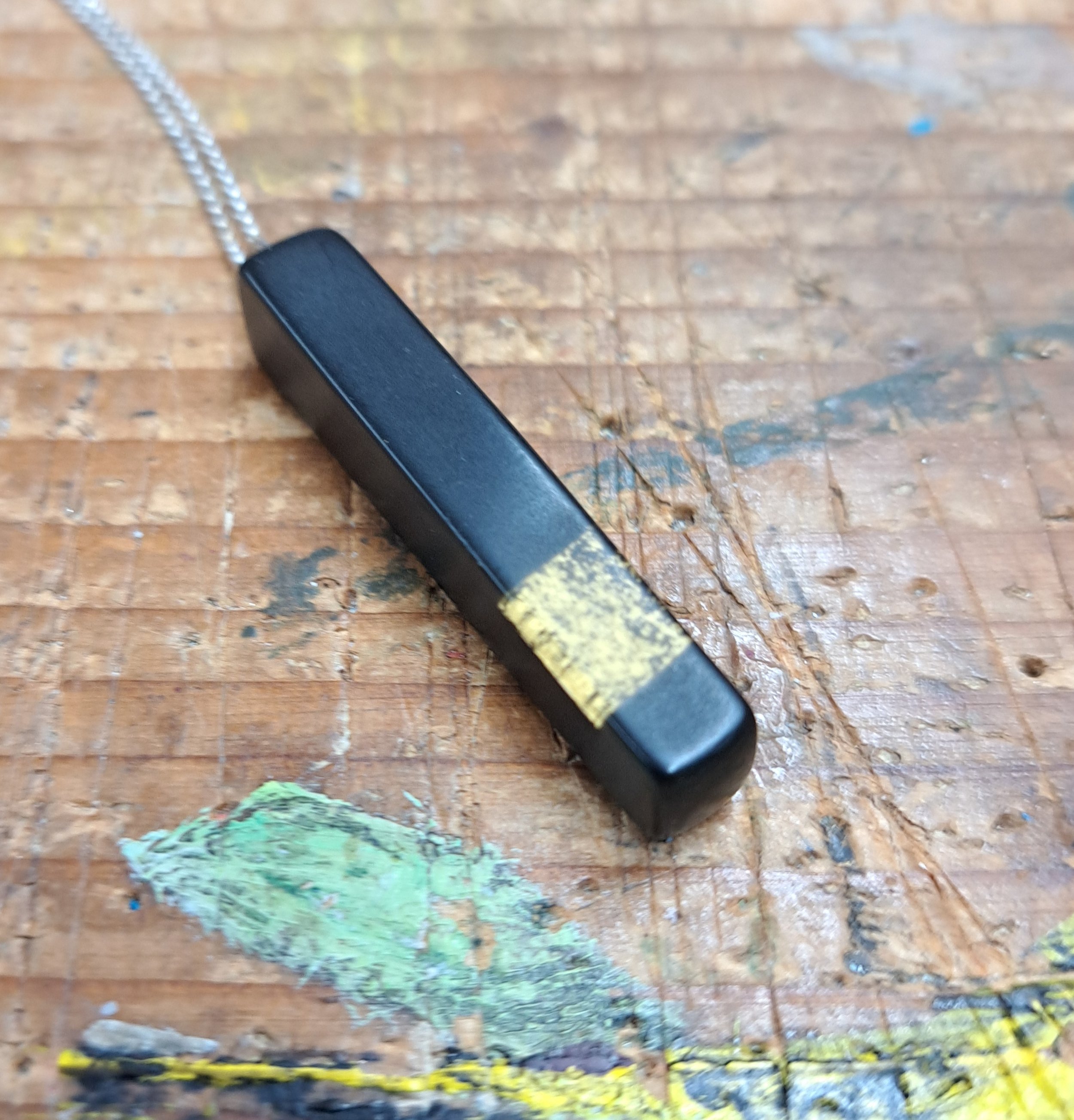 black and gold leaf pendant