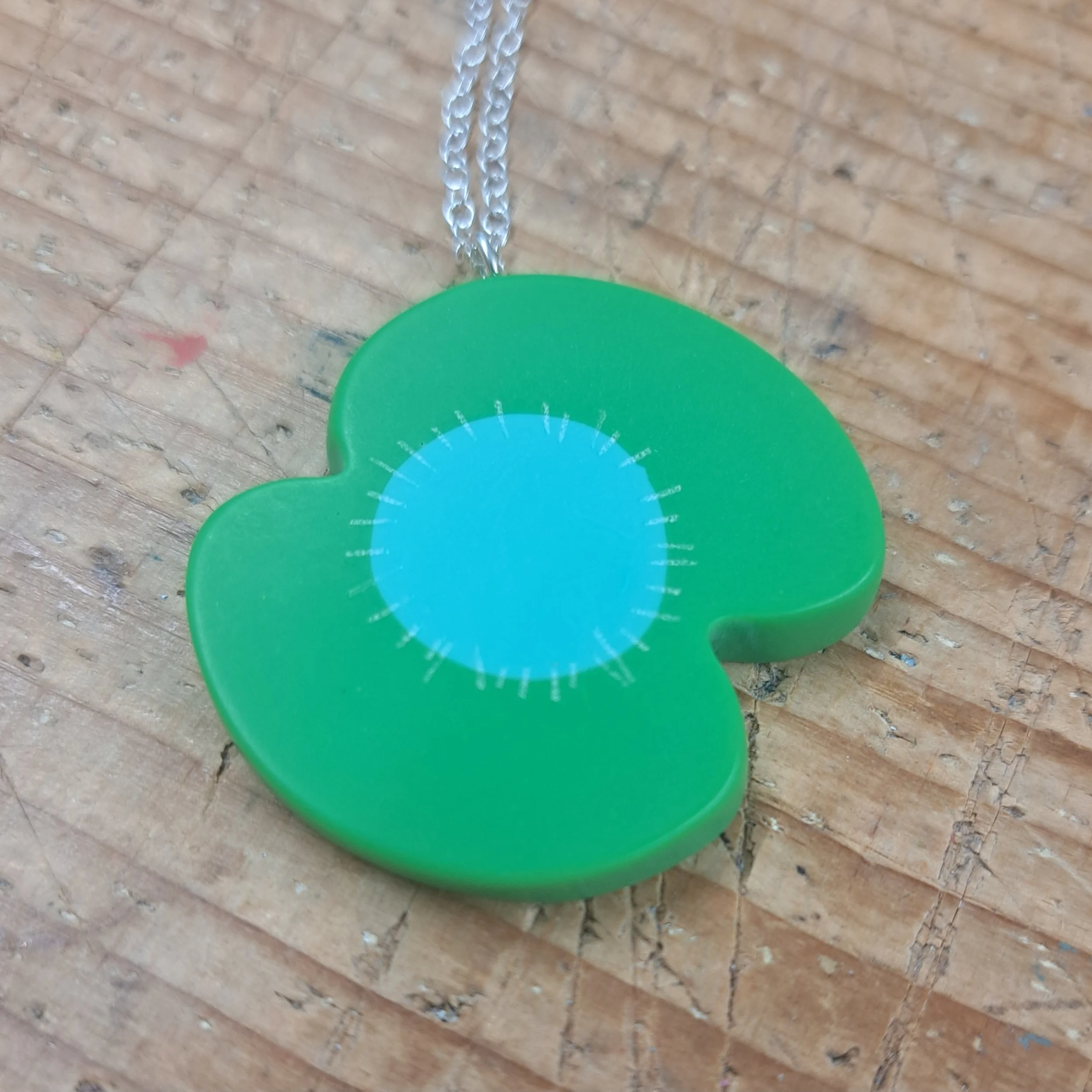 green poppy pendant