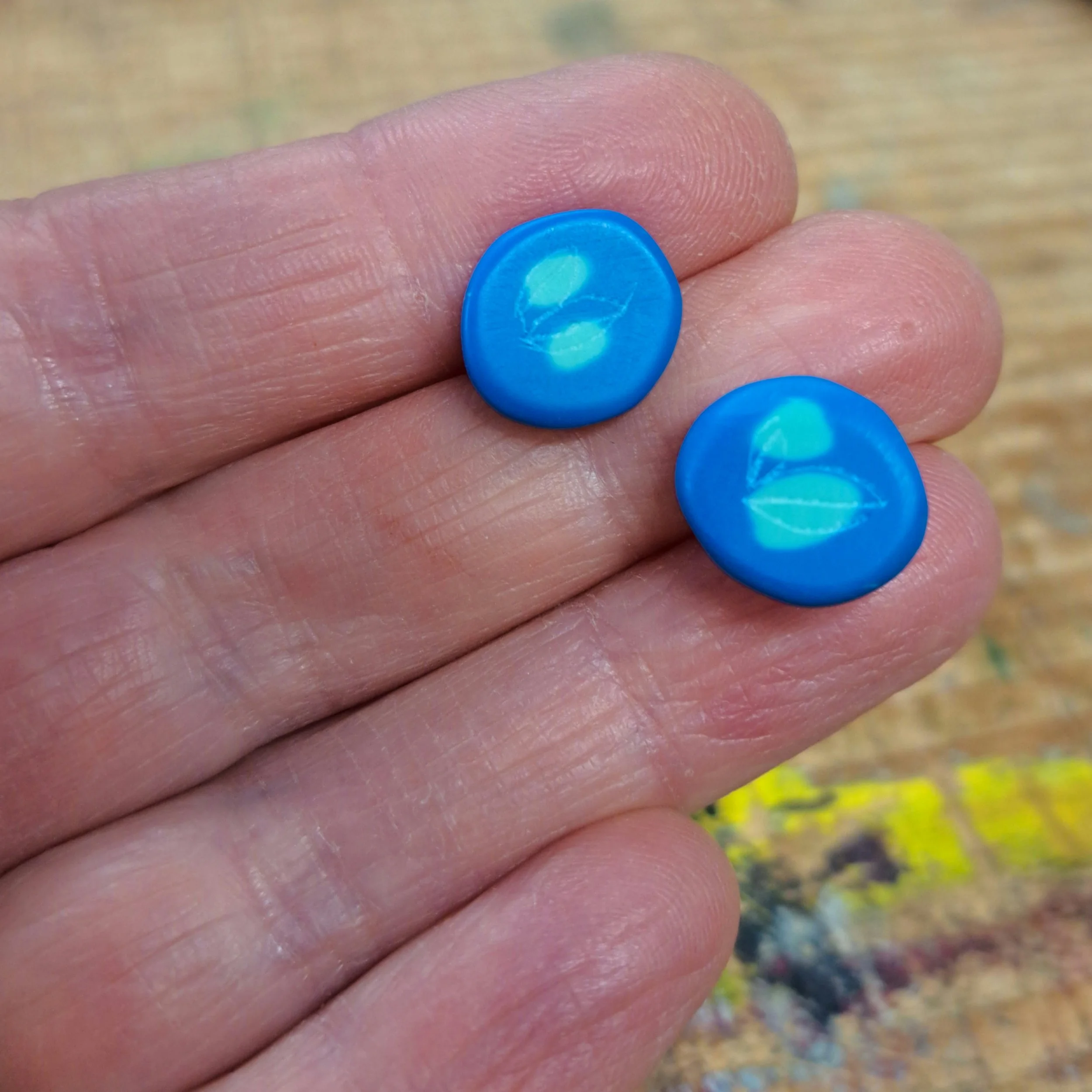 blue and aqua round studs