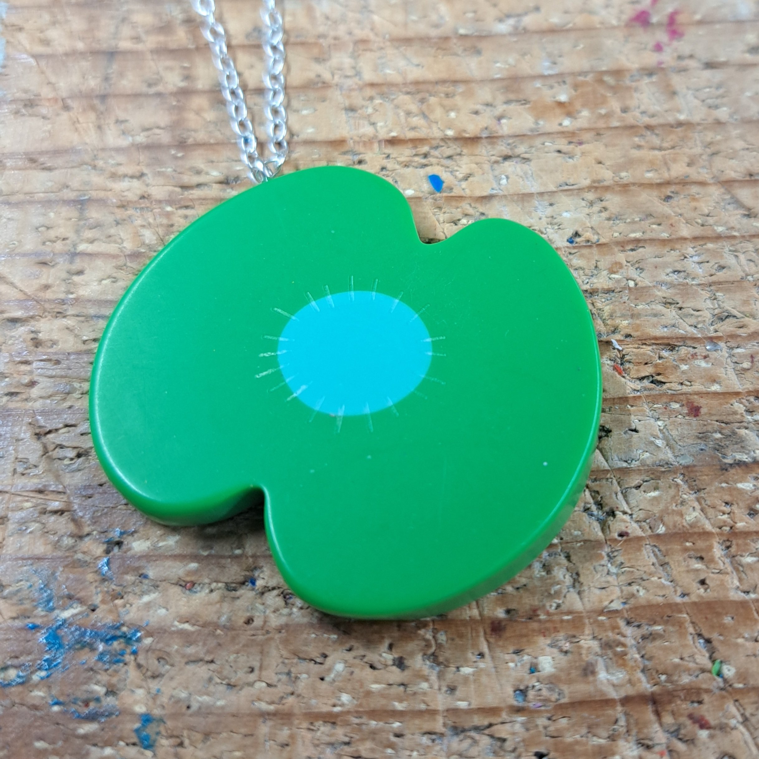 green poppy pendant