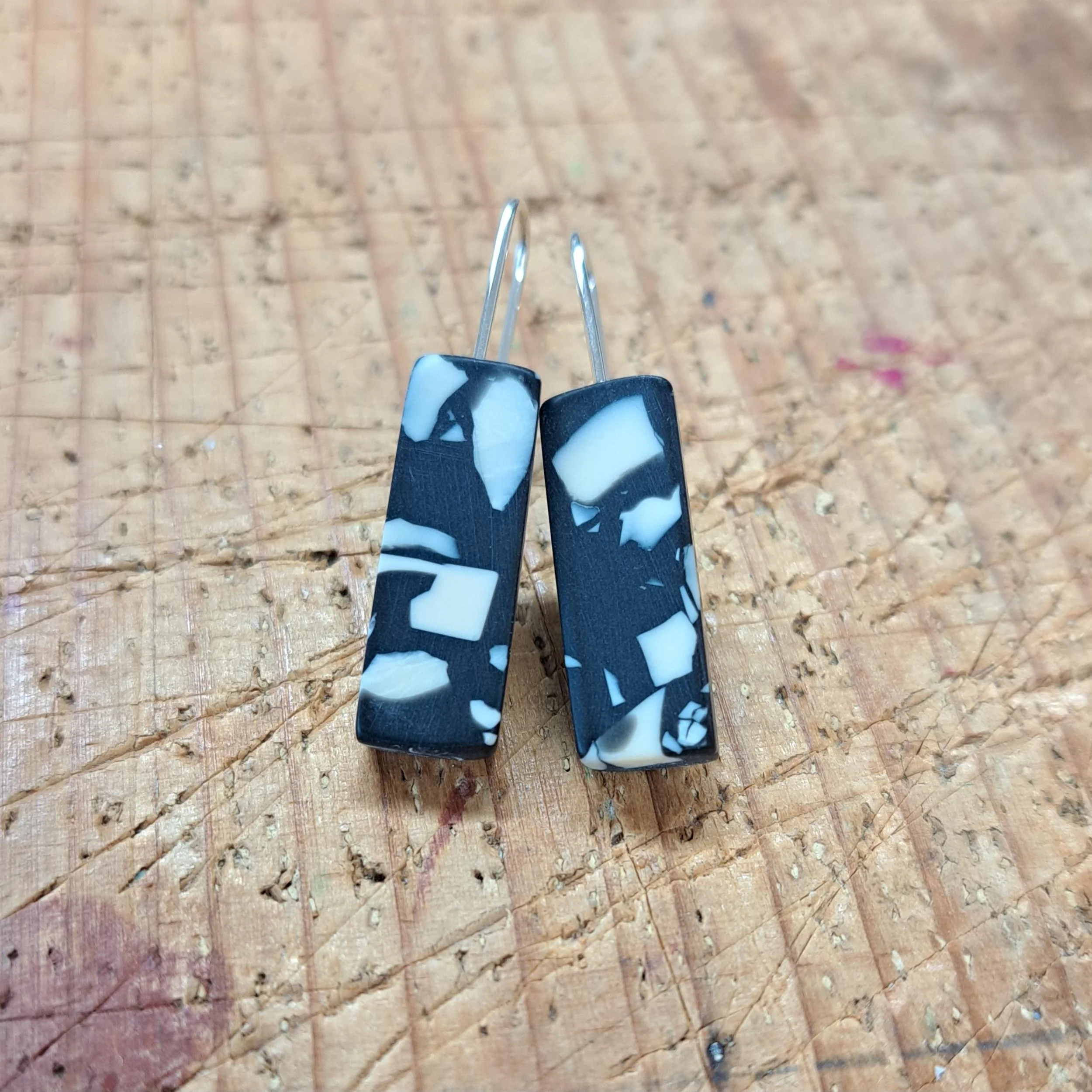 black with cream speckle little bar drops