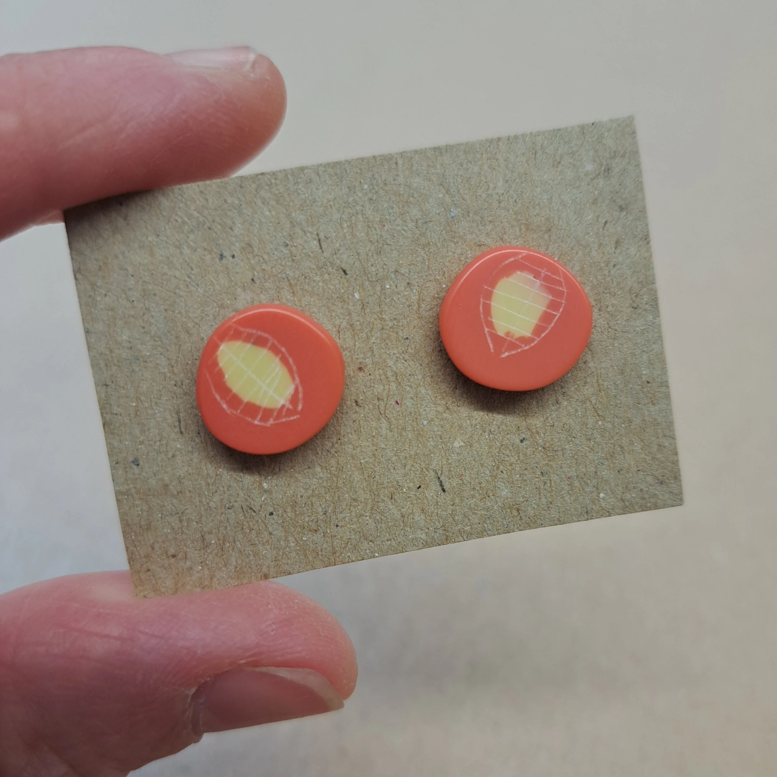 coral and yellow little round studs