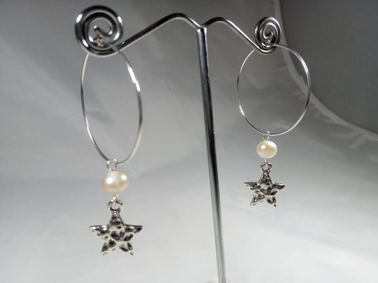Hypoallergenic hoops with a lovely freshwater pearl and hammered star drop 